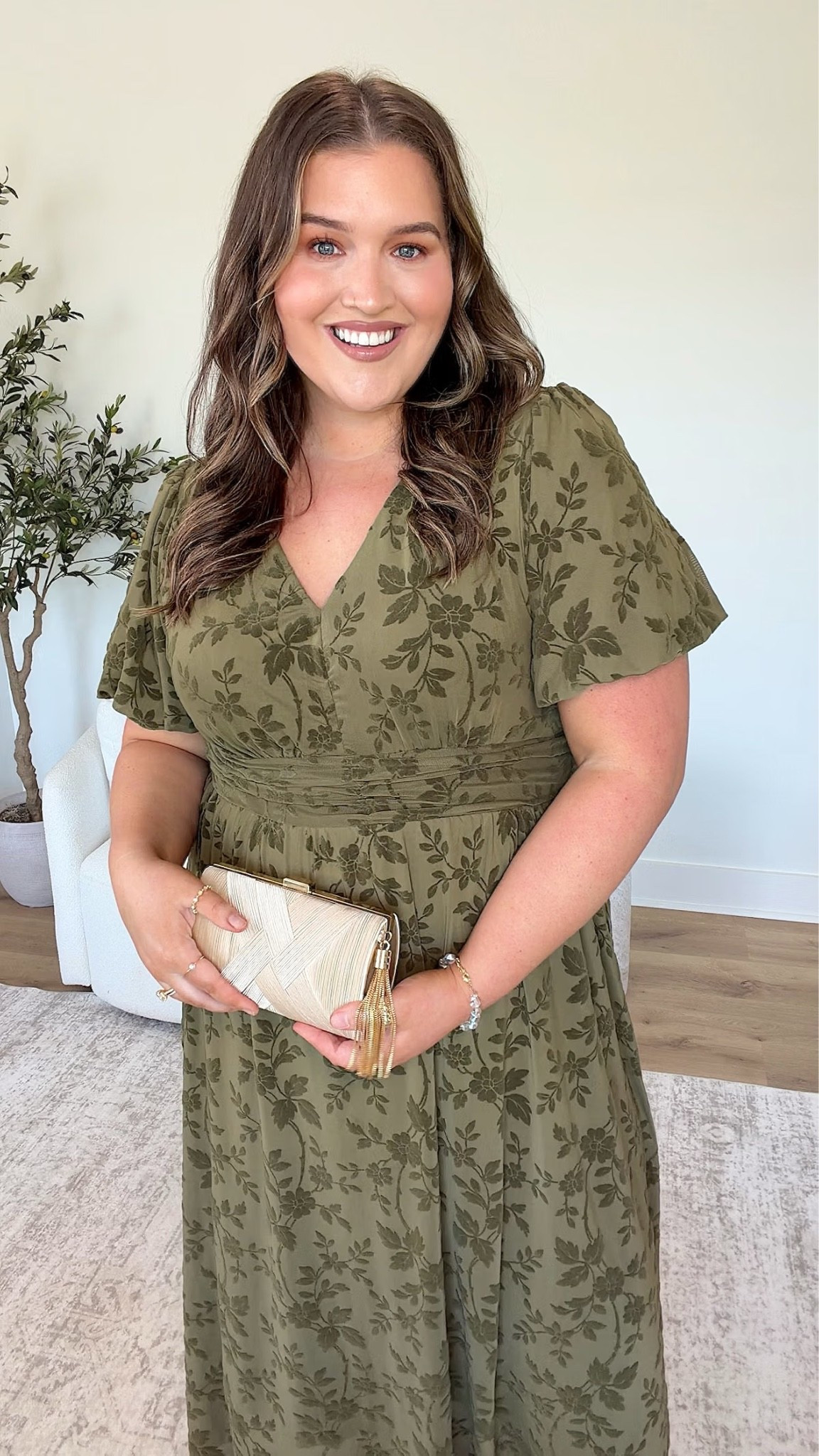 How stunning is floral short sleeve, green dress from Amazon?! It would be perfect for an early fall wedding, or family photos. I love that the flowers are understated, and that the color screams fall. I paired it with a neutral clutch and chunky gold heels to keep the look comfortable, on trend and so affordable. 
Plus size wedding guest dress, early fall wedding guest look

#LTKPlusSize #LTKSeasonal #LTKWedding