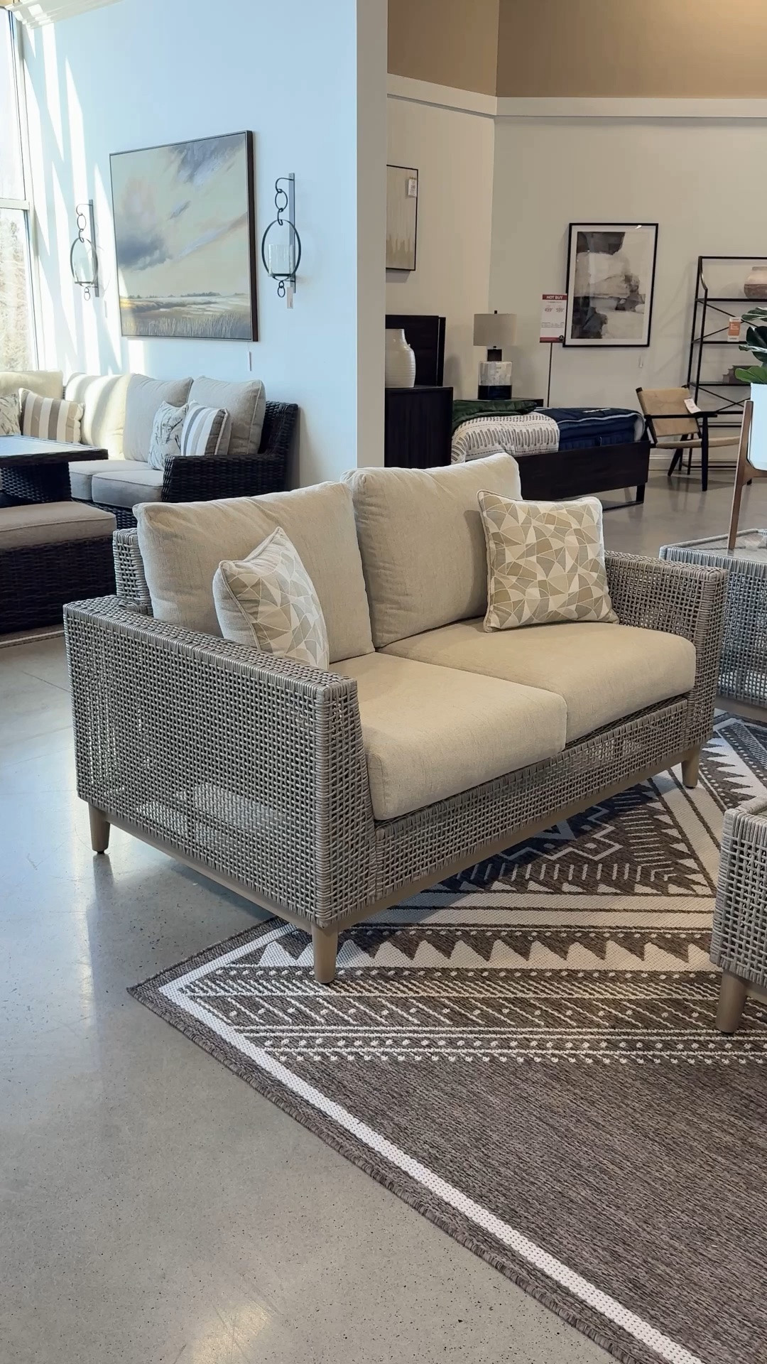 Modern patio setup!☀️ Loving the fresh, bright feel of the Seton Creek Outdoor Loveseat from Ashley Furniture with its gray woven texture and clean modern silhouette. 🩶 The neutral tones and plush cushions create such an airy outdoor lounge space for patio season. 🌿 #patioinspo #outdoorlounge #outdoorfurniture

#LTKHome #LTKSaleAlert #LTKSeasonal