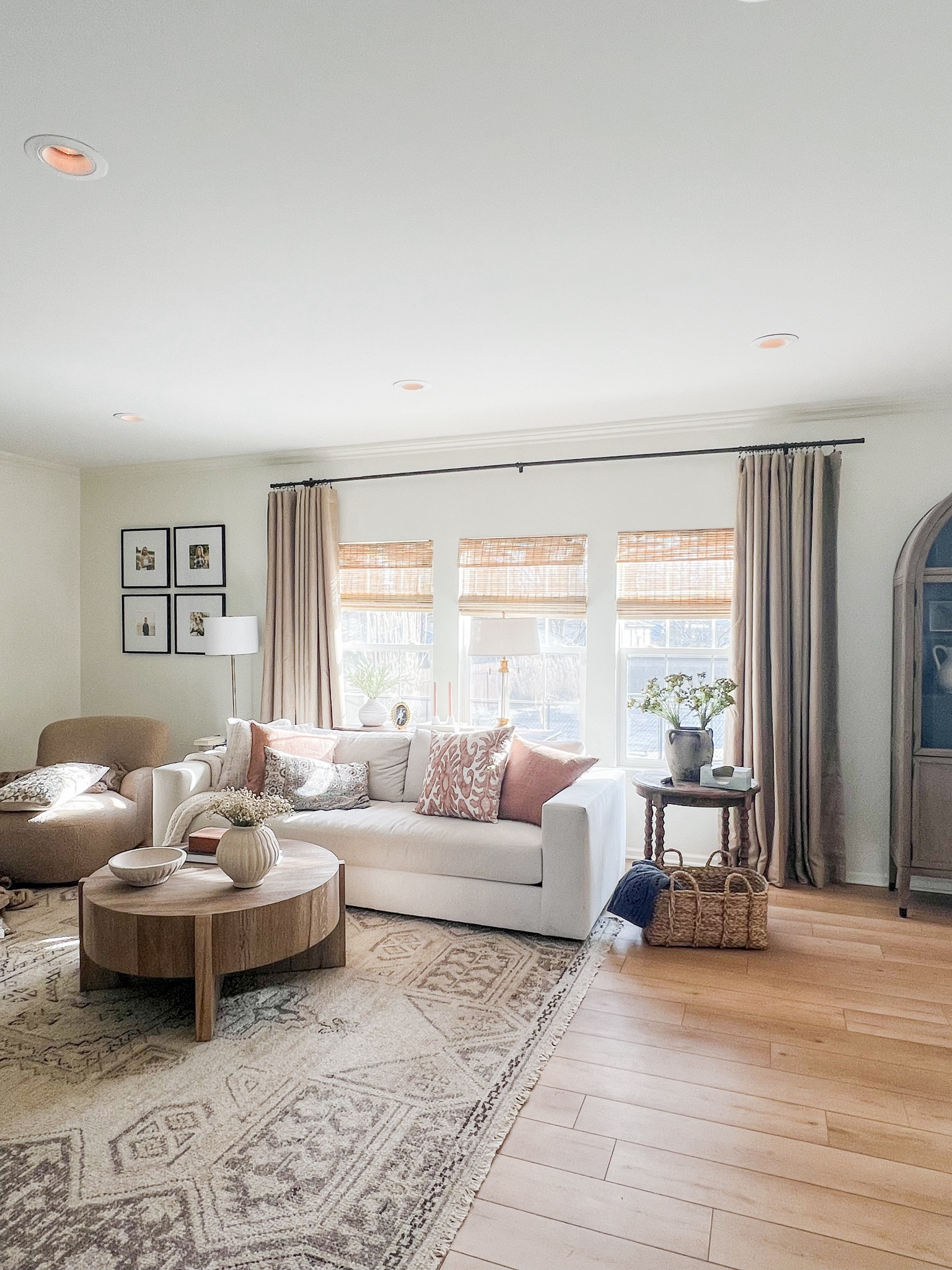 Neutral living room with white couch. Mid tone wood. Round coffee table. Modern organic living space  

#LTKhome