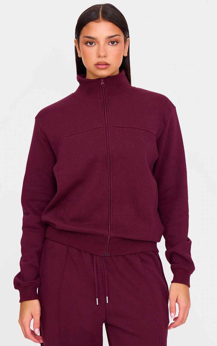 Burgundy Seam Detail Zip Through High Neck Sweatshirt | PrettyLittleThing UK