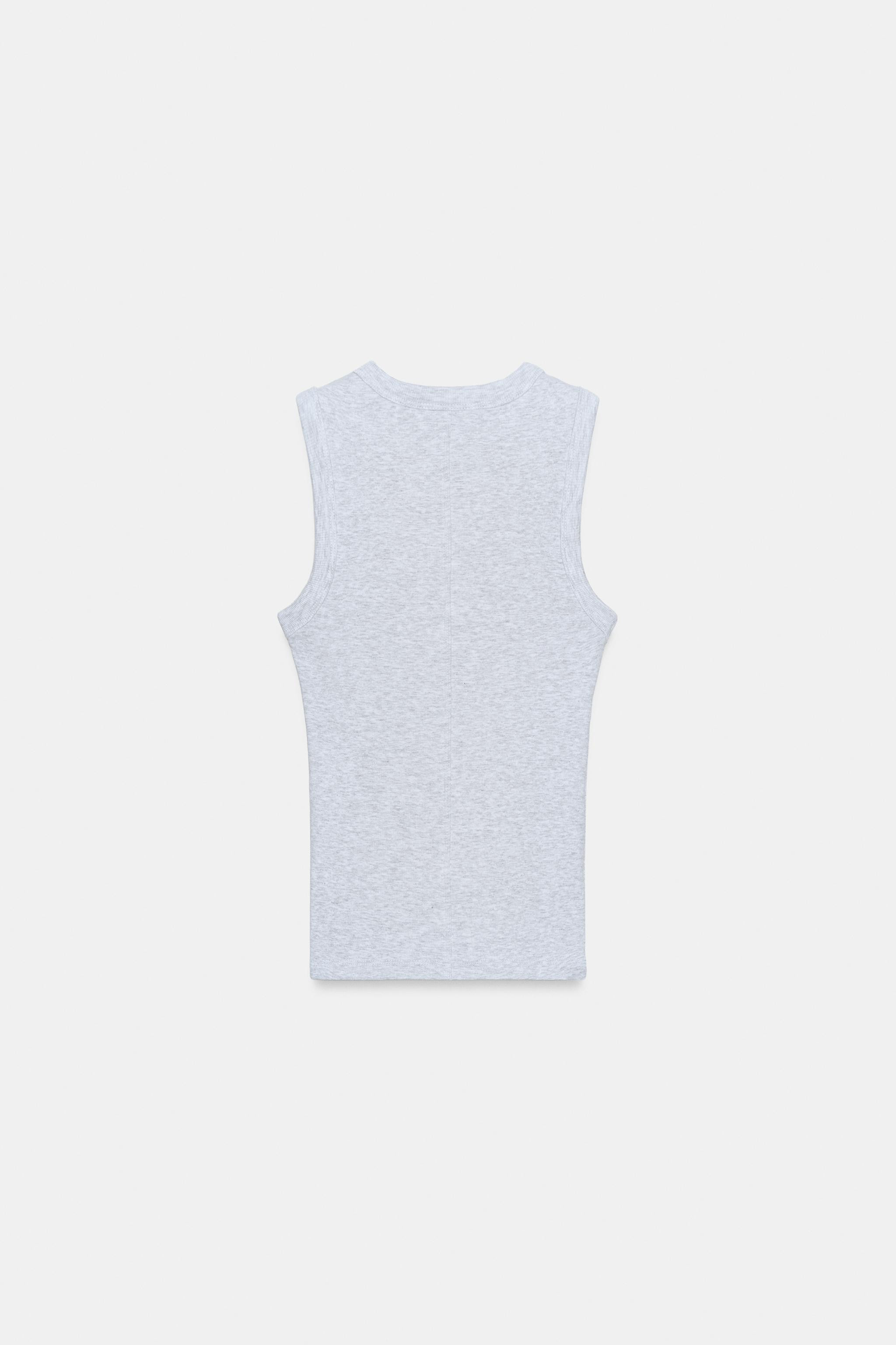DescriptionColourCompositionMeasurementsTop made from yarn in a cotton blend. Round neck and stra... | Zara UK