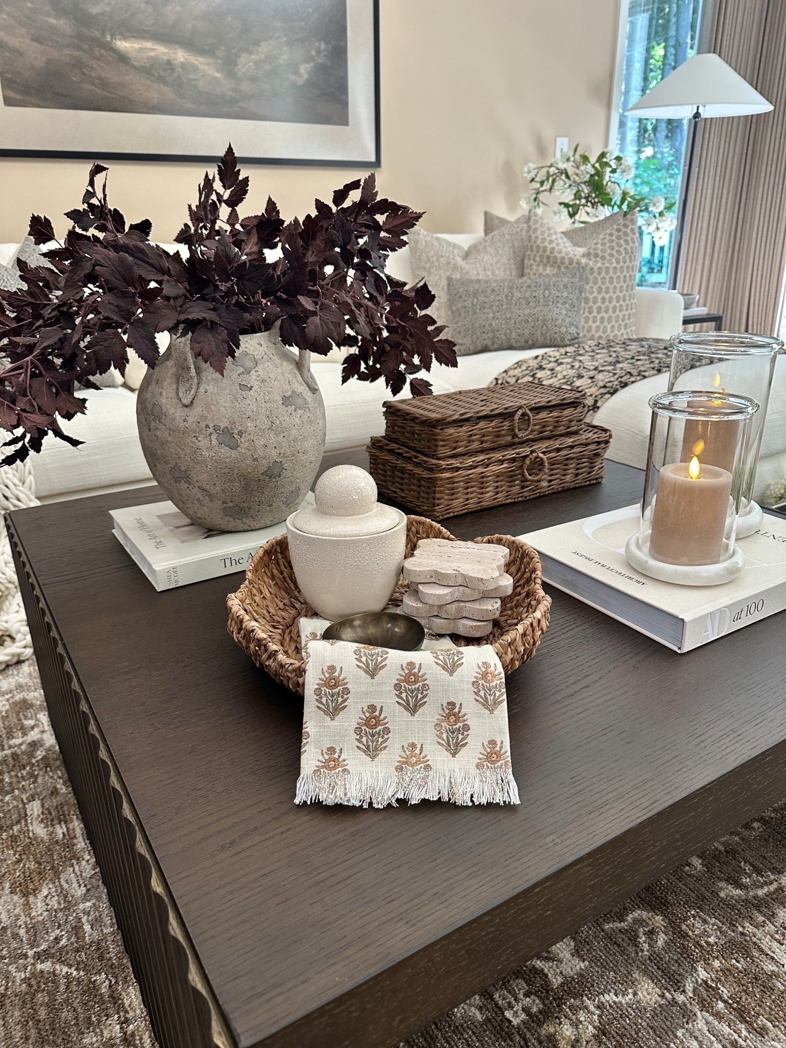 A cozy, collected coffee table moment 🤎
Follow @farmtotablecreations on Instagram for more daily home styling.

From the rich plum fall stems to the stacked woven boxes and hand block-printed napkin, this look is all about earthy layers and thoughtful textures. I love using a small basket to ground simple, functional pieces—like coasters, a small catch-all, and this lidded jar. It’s the little extras that make a space feel lived in and loved.

#sectional #livingroomrug #pillows #rugs #livingroomfurniture #coffeetabledecor #fallstems #neutraldecor #wovenbasket #amazonfinds #homestylingideas

#LTKSeasonal #LTKHome #LTKSaleAlert