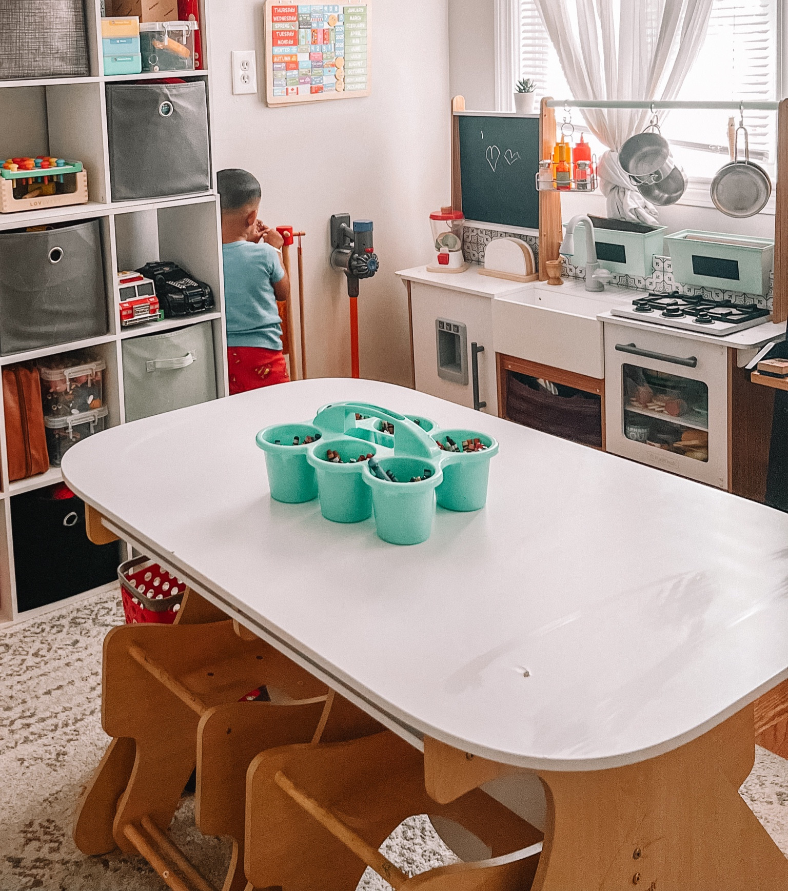 KidKraft table! Sits 4, the chairs are attached to the table, and you can hide and unhide them! Truly one of my favorite finds for our playroom!