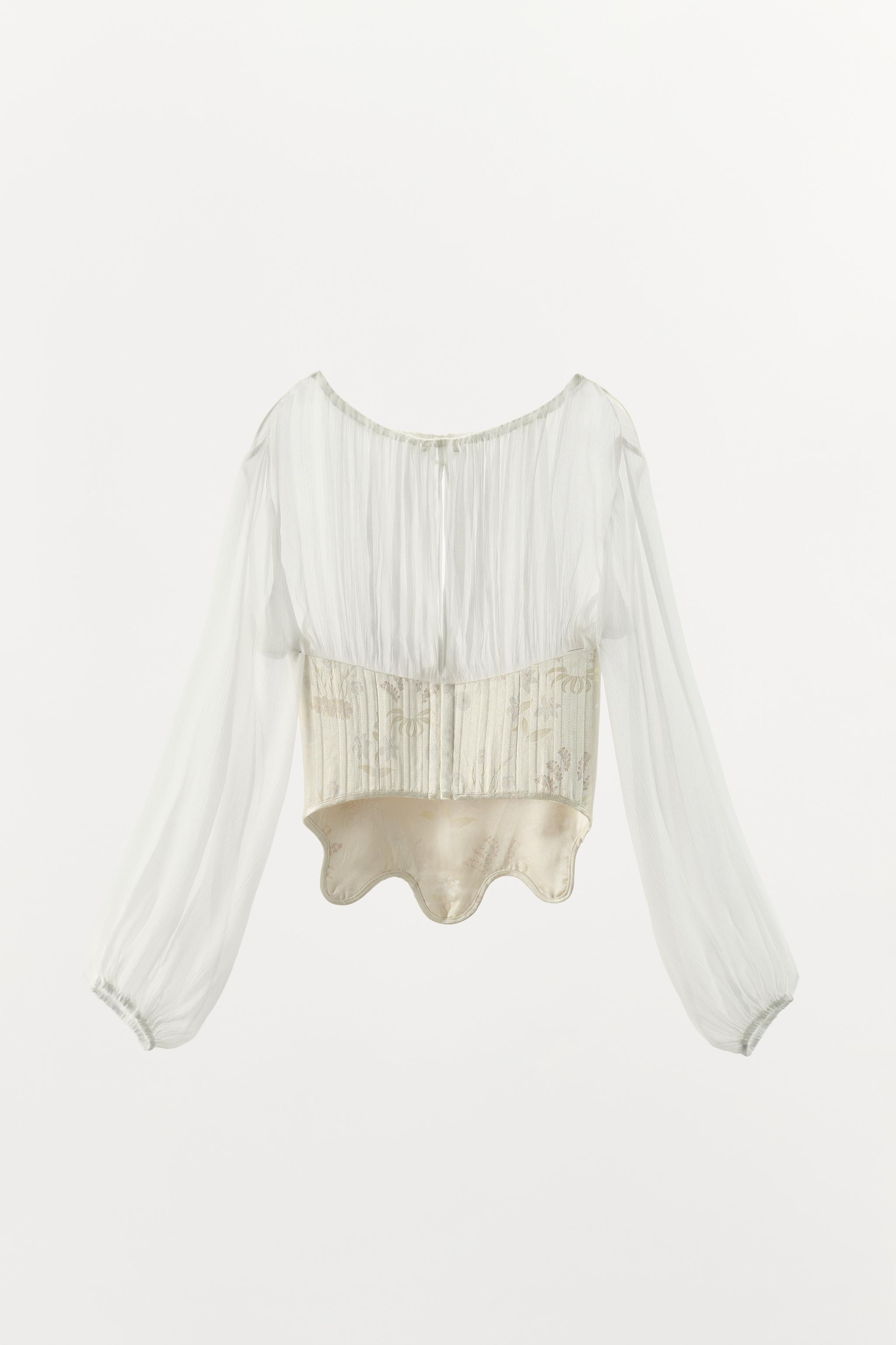 Corset-style blouse featuring a main fabric made from 100% viscose yarn. Designed with a boat nec... | Zara UK