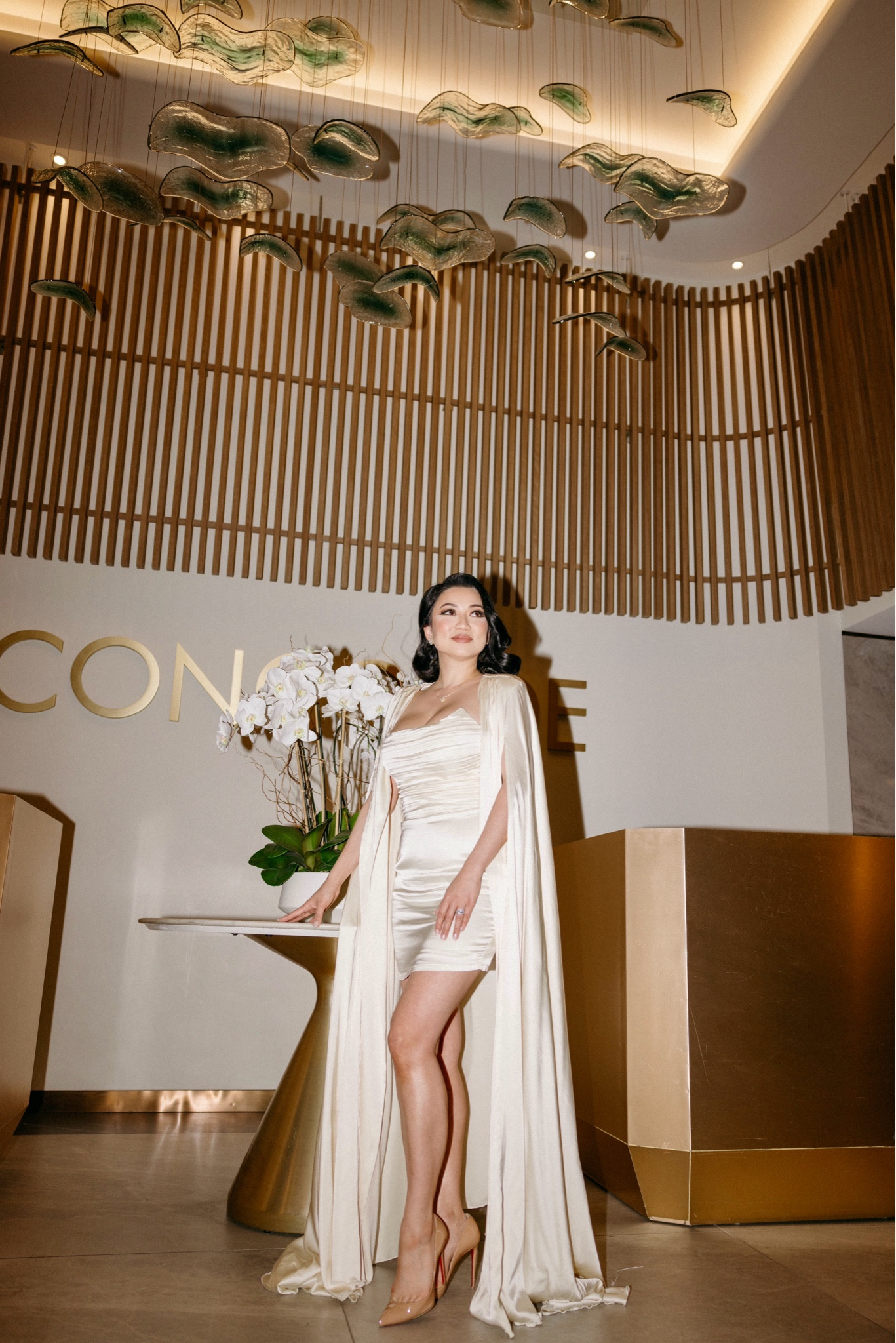 Bardot Mini Dress Cape Set by Michael Costello // Whether it's a cocktail party or a special event, the Michael Costello x REVOLVE Bardot Mini Dress Cape Set in Ivory is the perfect stunning ensemble. With a detachable shawl with padded shoulders that adds a touch of drama to your look, this mini dress crafted from ruched satin fabric, creates a flattering look you won't forget. I’m wearing sz small. Purchased from Revolve.

#LTKWedding #LTKParties #LTKOver40
