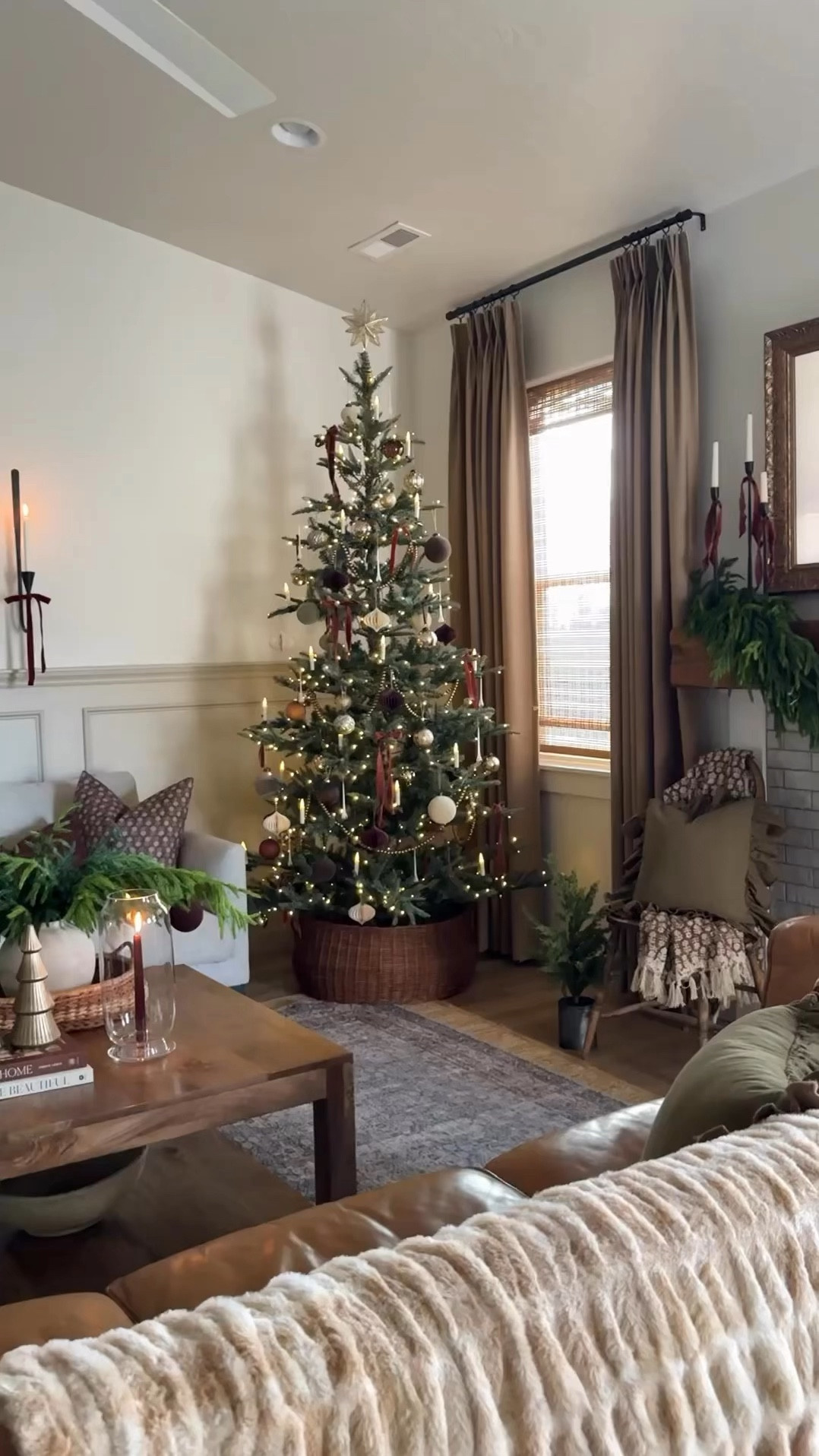 Christmas, living room, holiday, home decor, pre-lit Christmas tree, Living room inspo, custom curtains, pinch pleat curtains, floor to ceiling curtains, neutral sofa, beige sofa, west elm penn chair, green accent chair, vintage pillows, Turkish pillows, boucle pillow, shady lady tree, faux tree, greenery, Walmart floor lamp, woven table tray, square wooden coffee table, wall sconce, tapered candle holder, citrus tree, throw pillows, floor length mirror, arch mirror, Target home decor, affordable home, black cabinet, studio McGee cabinet, round glass coffee table, target accent table, vintage inspired rug, vintage milking stool, foot stool#LTKVideo

#LTKHoliday #LTKHome