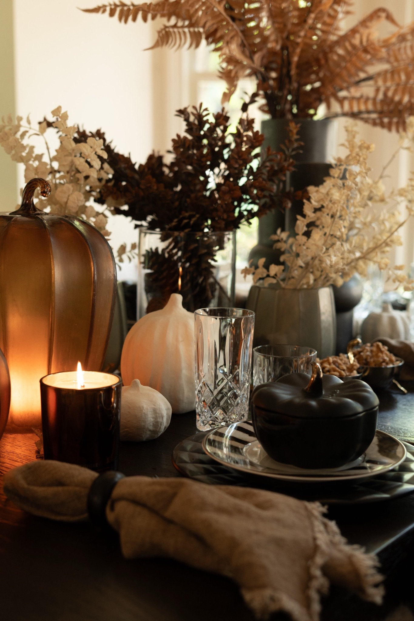 Can we just take a moment for this fall centerpiece magic??! I’m in LOVE with the dramatic mix of dried foliage, neutral pumpkins, and layered glass and ceramic textures. It’s giving high-end harvest vibes with a modern twist—perfect for an elegant Thanksgiving or cozy autumn gathering. Every detail feels intentional and luxe, from the crystal glasses to the sculptural florals. I can't  wait for all of the yummy fall recipes that we will get to enjoy here!  

 #LTKSeasonal #LTKHome #LTKStyleTip