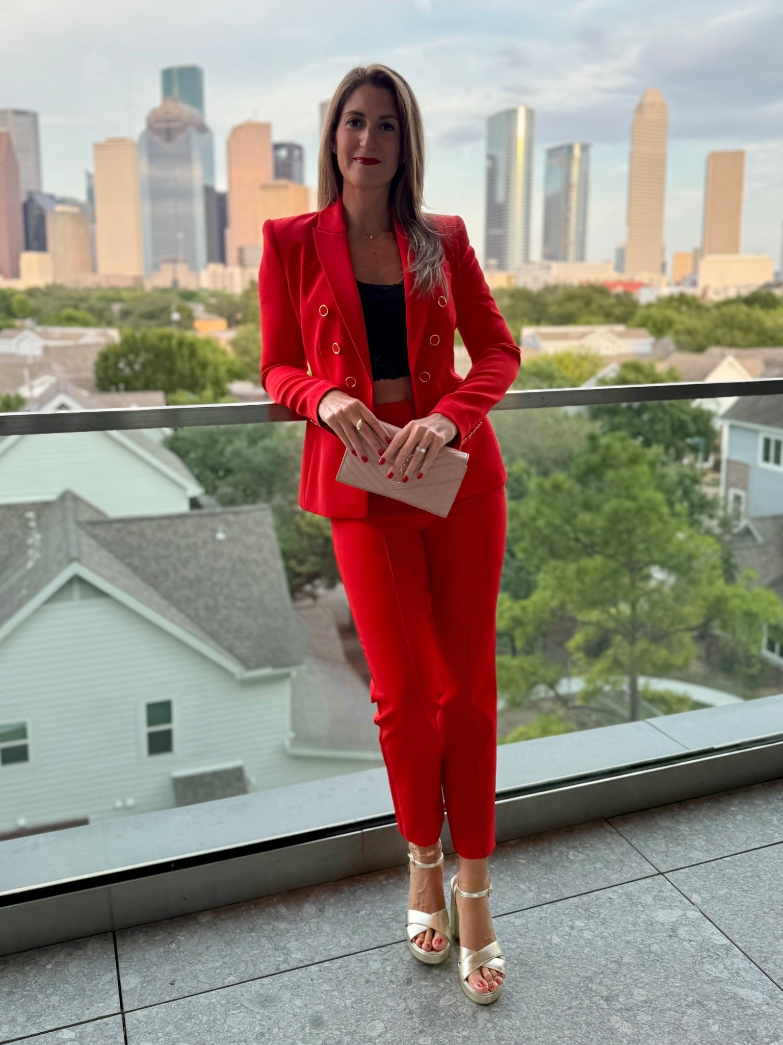 Had so much fun styling this red suit for a fashion show. I paired it with a black lace bralette underneath for an edgy and modern vibe and finished it with a neutral clutch and gold platform sandals. This is how you take suiting from work to weekend!

Blazer runs TTS. Wearing size S.
Pants run small. Wearing size 8. 
Sandals run TTS. 

#LTKOver40 #LTKSaleAlert #LTKWorkwear