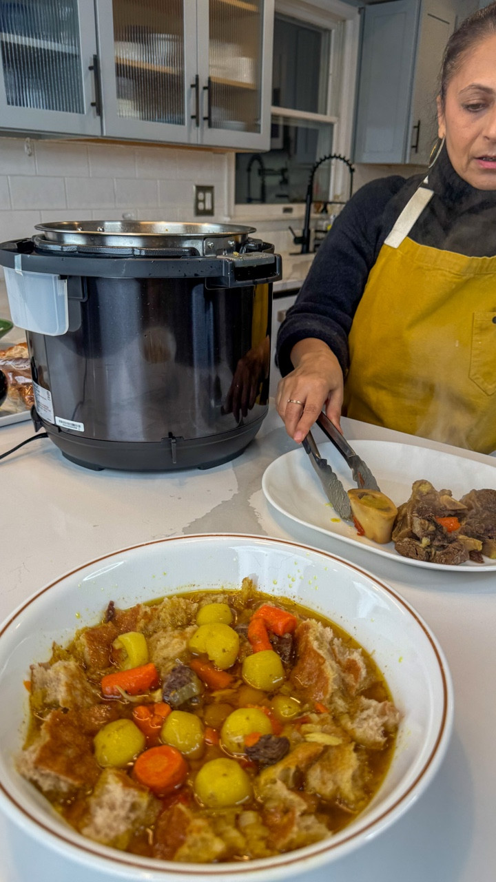 This is the epitome of the Afghan kitchen to me. Simple ingredients treated with kindness and respect. Not fancy, not extravagant, but completely satisfying. 

Shorwa

2 tbs vegetable or olive oil
1 onion, sliced (about 1 cup)
4 cloves garlic, peeled
2 small tomatoes, chopped
2-3 tsp salt (2 tsp if you use broth, 3 if you use water)
1/2 tsp turmeric
1 tsp whole cumin seed
1 tsp ground coriander
1/2 tsp ground cumin
1/2 tsp black pepper
2 lbs bone in meat - beef or lamb 
8 cups water or broth (I used a mixture of both)
3 carrots, cut into bite sized pieces
2 potatoes, peeled and cut into bite sized pieces. I used baby whole potatoes
1/2 Afghan naan, torn into bite sized pieces and put into a bowl

Heat the oil in a pressure cooker/instant pot. Add the onion and cook until lightly golden brown. Add garlic and stir for another minute. Add tomatoes, salt and spices and cook another minute or two until the kitchen is fragrant. Add the meat and stir it making sure that it gets completely covered in the onion spice mixture. You just want it to lose the raw color. Add the broth/water and cover. Cook on high for 30 minutes. Release the pressure, open and add the carrots and potatoes. Cover and cook on high pressure again for 10 minutes. Release the pressure. Meat should be falling off bone tender and veggies should be soft. 

Take the meat out of the pot and put it into a serving platter. Pour the broth and veggies over the bread. Serve with chopped cilantro, green onions and I always love a pickled onion. 

#afghanfood #afghan #afghanistan #ramadan #halalfood #soup #easy #homecooking #pashto