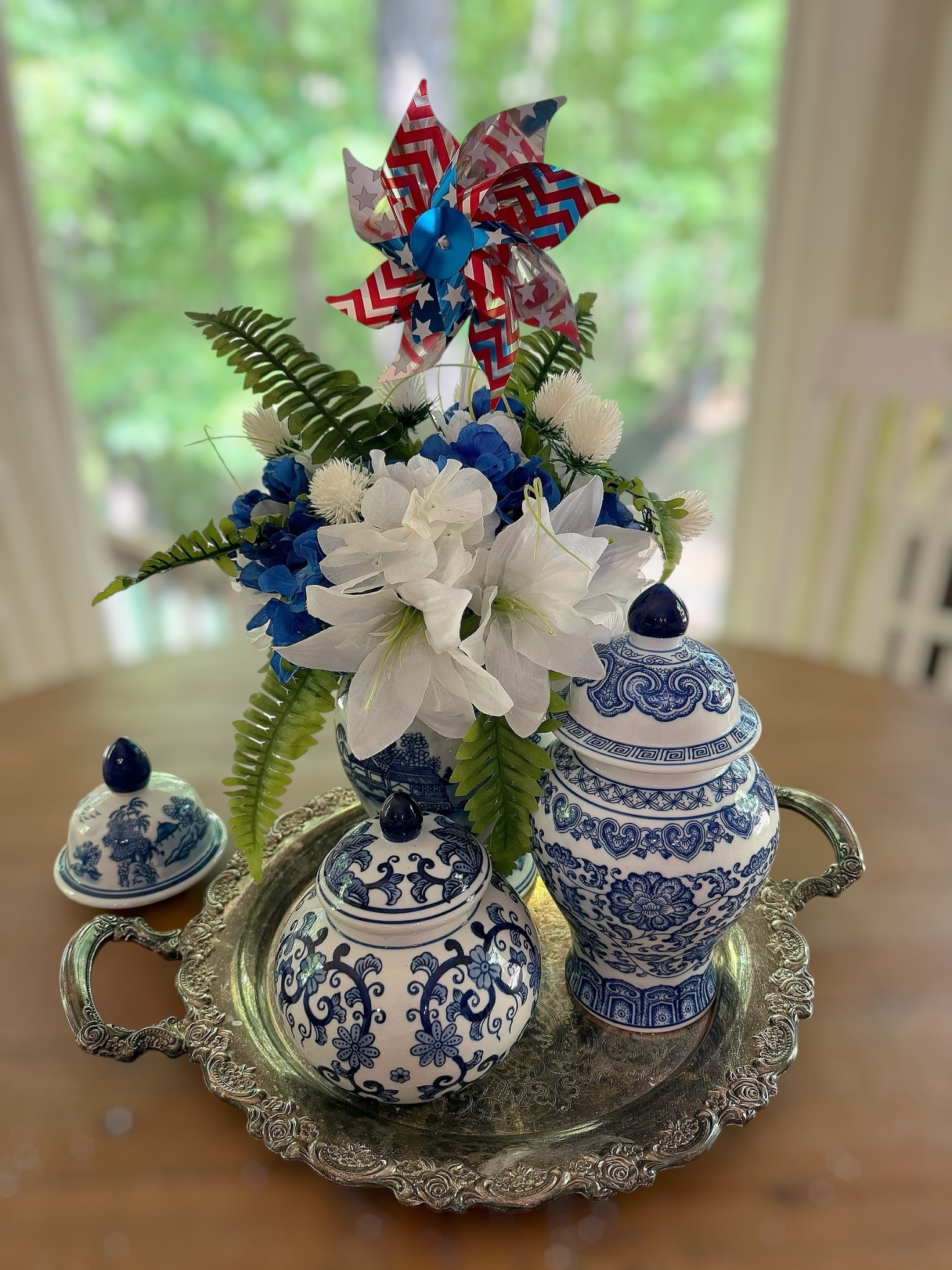 Patriotic Chinoiserie Centerpiece 🇺🇸💙 Summer Table Decor

Red, white & blue done the prettiest way 🇺🇸✨ I styled this patriotic centerpiece using blue and white chinoiserie ginger jars, faux hydrangeas, lilies, and greenery with a festive pinwheel topper for the perfect summer tablescape. Such an easy way to elevate your home for Memorial Day or the 4th of July while keeping that classic, timeless look 💙🤍

All pieces are affordable finds and can be mixed and matched for coffee tables, kitchen islands, or entryways. Love how the soft florals balance the bold patriotic touch!

Patriotic home decor, chinoiserie ginger jars, blue and white decor, summer centerpiece ideas, 4th of July table decor, Memorial Day decorations, faux floral arrangement, hydrangea decor, classic preppy home style, affordable Amazon home finds

#LTKmomlife #LTKSeasonal #LTKHome

#LTKHome #LTKmomlife #LTKSeasonal