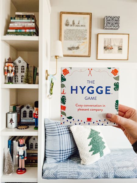 Hygge game conversation cards — great gift idea or something to bring to holiday gatherings!

Also pictured and linked: tree pillow, gold wall sconce with linen shade, reversible throw blanket on bench cushion, similar zinc houses 

#LTKfamily #LTKHoliday #LTKGiftGuide