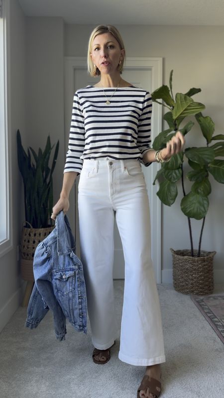 White wide leg jeans outfit for spring with a stripe tee, denim jacket + leather slides.

I’m wearing a size 28 tall in these jeans - I’m 5’10” 
I recommend going up a size for a loose, relax fit 

#LTKVideo #LTKover40 #LTKfindsunder50