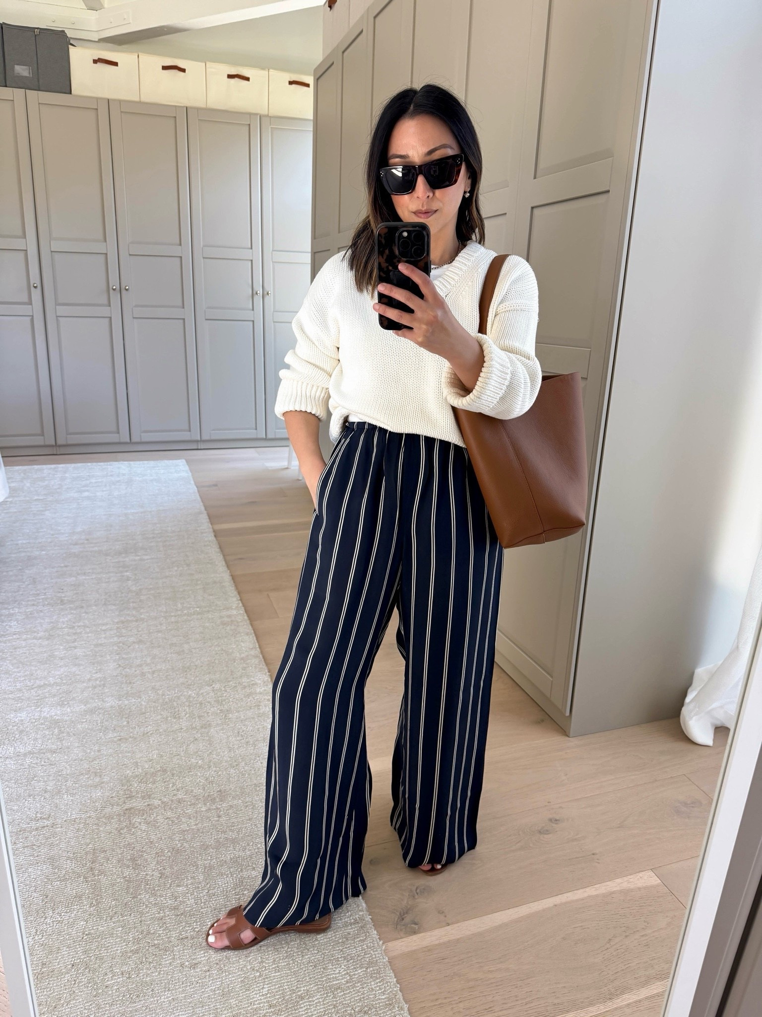 The silky pants that will take you from day to night. Come in petite and regular lengths. 

J.Crew Cosmo pants petite small
Banana Republic cottons sweater xs - new version might be slightly different
Hermes Oran sandals 35
Quince bucket bag
Celine sunglasses
Electric picks earrings
Dorsey James necklace 15"

Spring outfits 2026, petite style

#LTKootd #LTKPetite #LTKSaleAlert