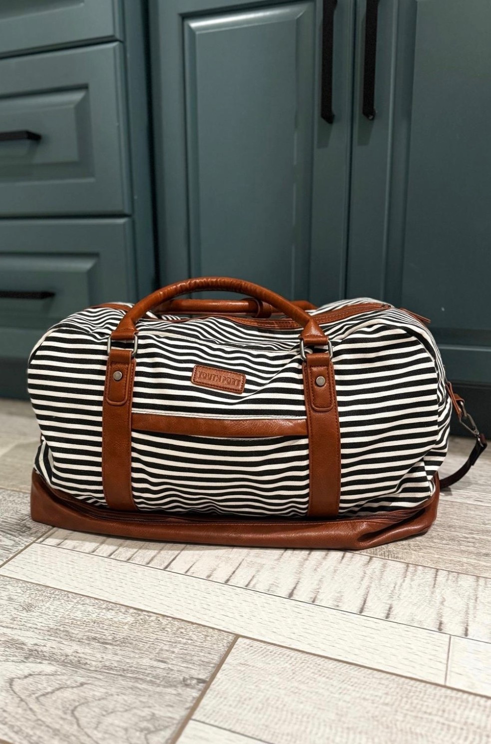 Shoe compartment had me sold! Getting ready to travel for the spring break. This bag holds SO much! It has a shoe compartment on the bottom (fits 3 pairs or 2 pairs of boots!) There’s a waterproof pouch inside and lots of other organization too!

It also will slip onto a roller bag so it is perfect for flights! 10/10 and totally affordable. Comes in lots of other colors too! 

#LTKTravel #LTKSaleAlert #LTKdayinmylife