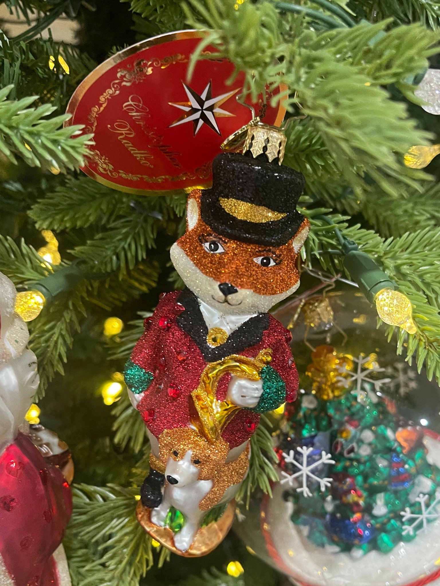 🦊 Christopher Radko Festive Fox Ornament

This darling Christopher Radko “Festive Fox” ornament is such a charming addition to your Christmas tree 🎄✨ Hand-crafted European glass, glittered details, and the sweetest little fox in a top hat holding a horn with his pup at his feet — it looks like a storybook piece come to life. 💛

It’s part of the Radko 2023 collection, made in Poland, and comes beautifully packaged in the official Radko gift box, making it a perfect keepsake or gift for anyone who loves classic, collectible ornaments. Only a few left in stock, so grab it while it’s marked down! 🎁🦊✨

holiday ornament • Radko fox • collectible Christmas decor • European glass ornament • Christmas tree decorations • gifting ideas • holiday home accents

#LTKGiftGuide #LTKHome #LTKHoliday