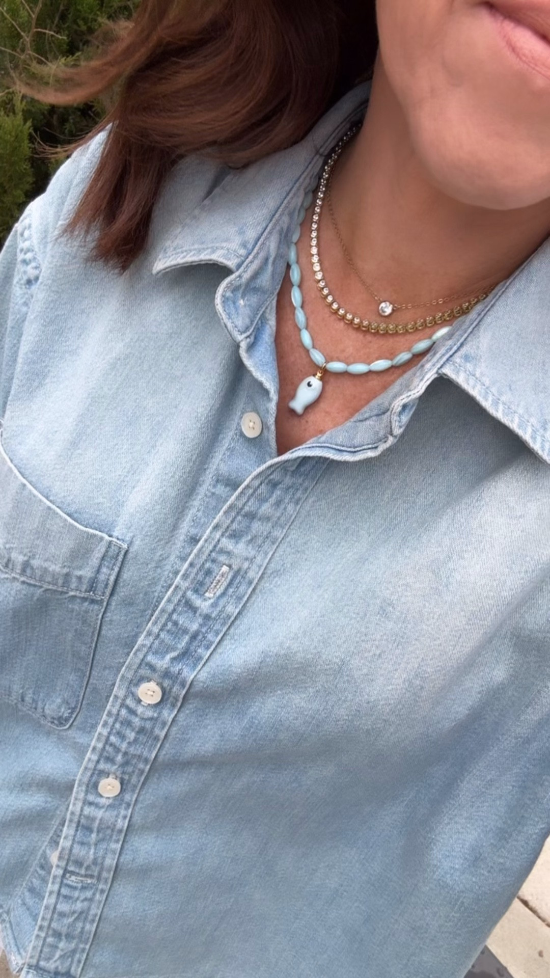 Cropped chambray shirt 30% off. Fish charm beaded necklace. Necklace stack. White denim. 
Shirt XS. Jeans down 1 size, 24. 

#LTKSaleAlert #LTKOver40 #LTKootd
