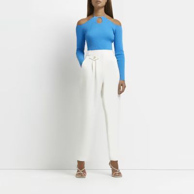 Cream pleated tapered trousers | River Island (UK & IE)