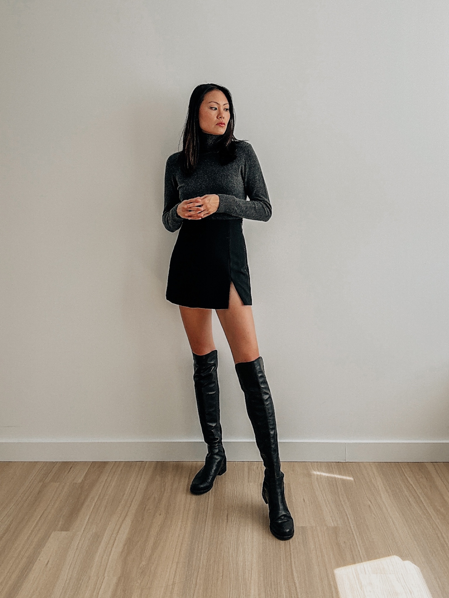 Fall outfits idea. Winter outfit idea. Quince cashmere sweater turtleneck. Slit skort, Stuart Weitzman 5050 over the knee boots  

#LTKSeasonal #LTKstyletip