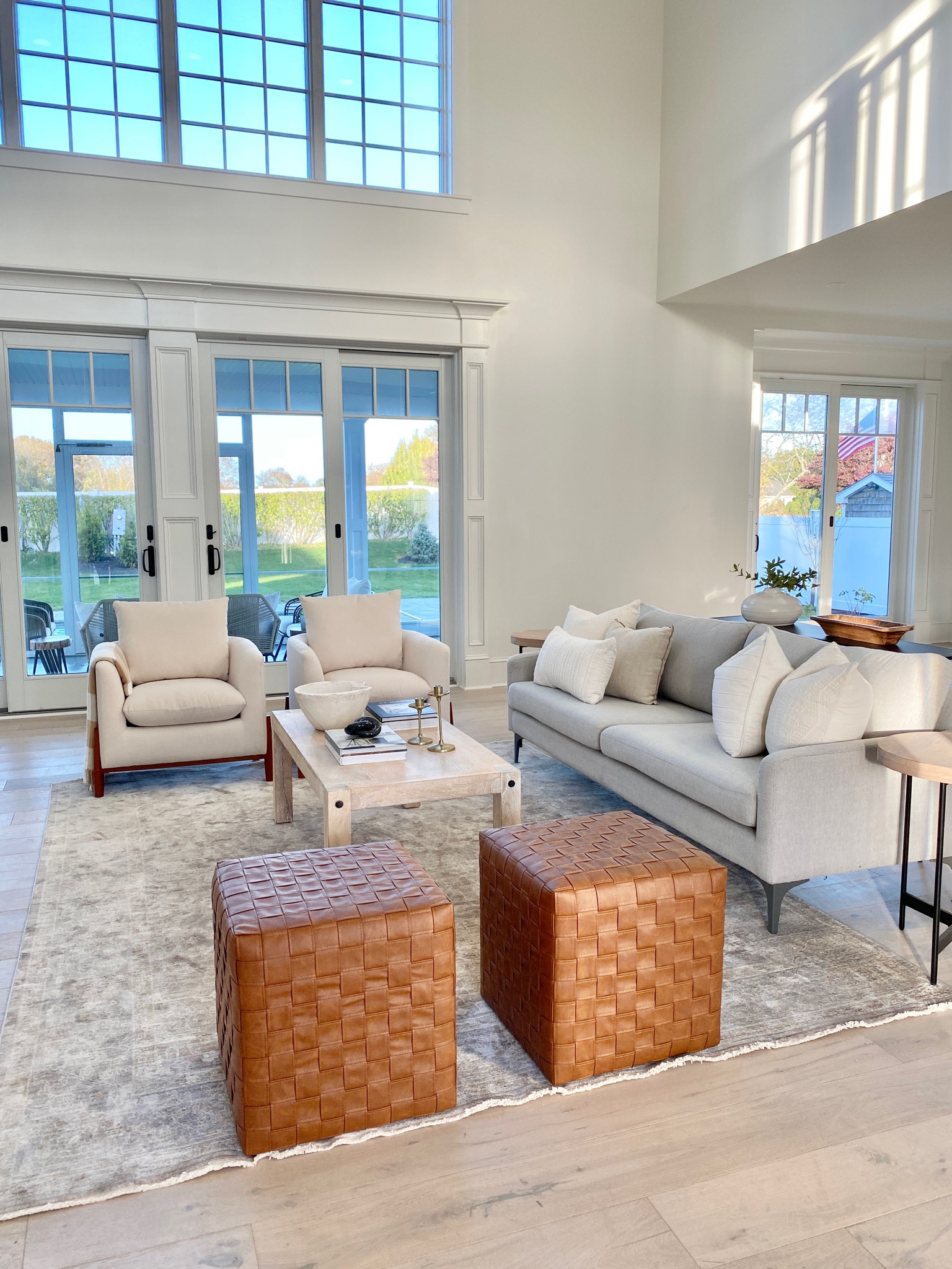 Woven leather cubes, gray modern couch, neutral living room decor.

#livingroom #livingroomdecor

#LTKhome