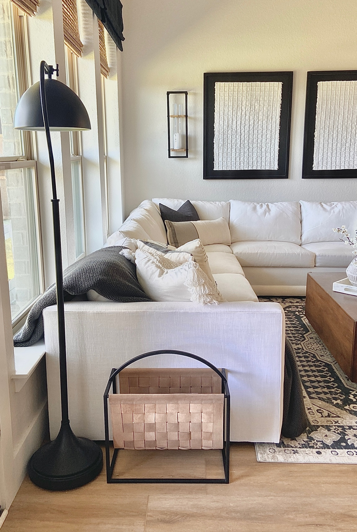 Cozy modern living room 
#whitecouch #magazinerack #blackfloorlamp #squarecoffeetable #targetdecor 

#LTKhome #LTKunder50 #LTKunder100