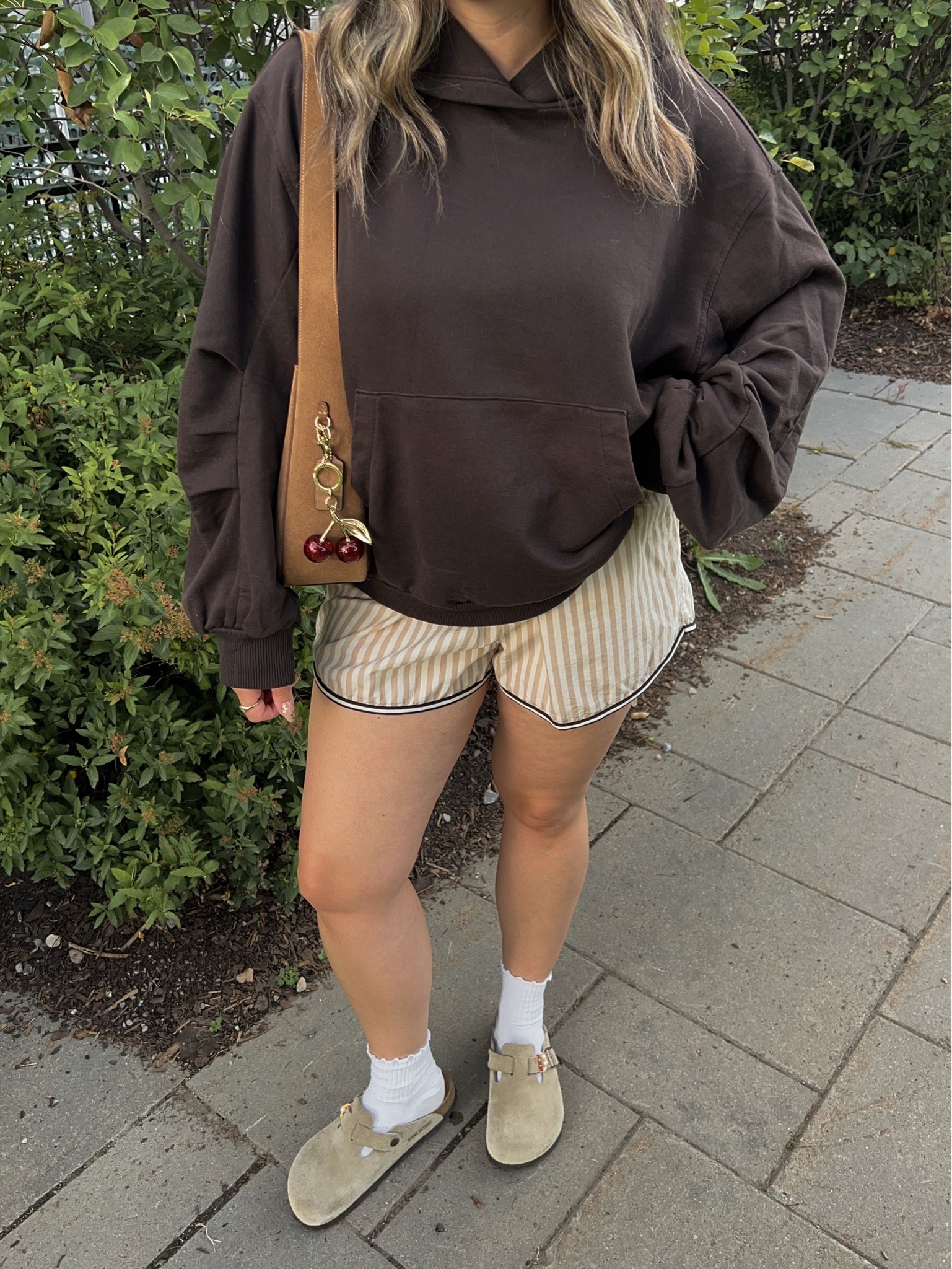 Comfy early fall outfit! Wearing M in the chocolate brown hoodie. Wearing L in the striped boxer shorts but should have done M (exact Canadian shorts link under “similar products”). I’m a 9.5-10 shoe and wear a 40 in the Birkenstock clogs

#LTKfall #LTKsale #LTKmidsize