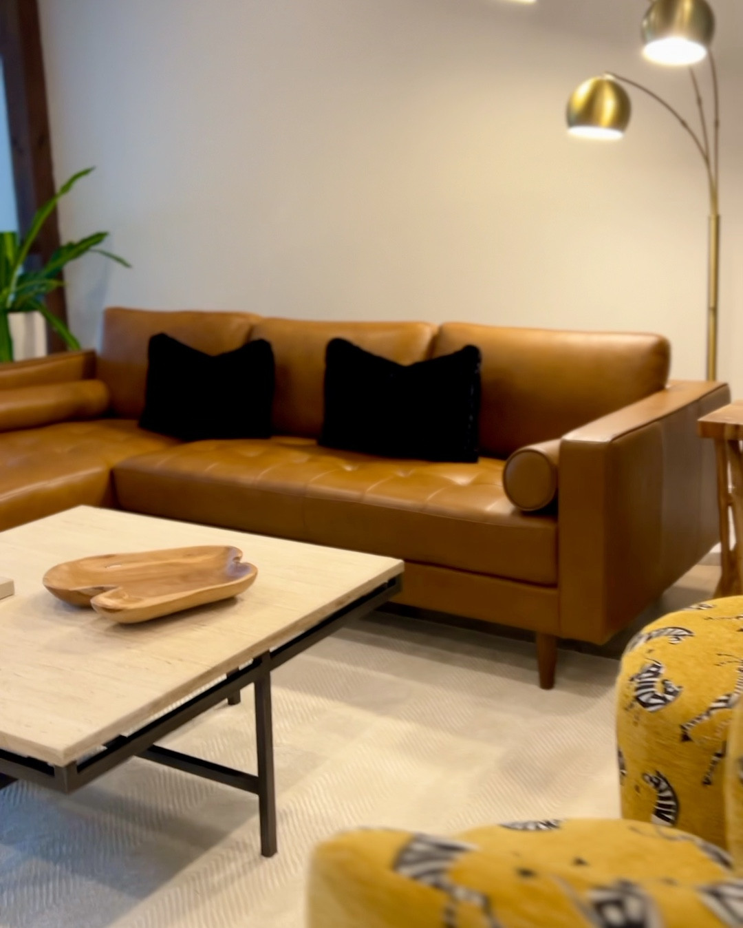 A dream statement cognac leather couch with chaise ON MAJOR SALE! It’s even more lux in person.  (Option of right or left facing chaise)  
•Firm so it’s great for the lumbar, but still cozy.  
•Durable, peel resistant.
•Blends with our spray tan 😂 



#LTKSaleAlert #LTKHome