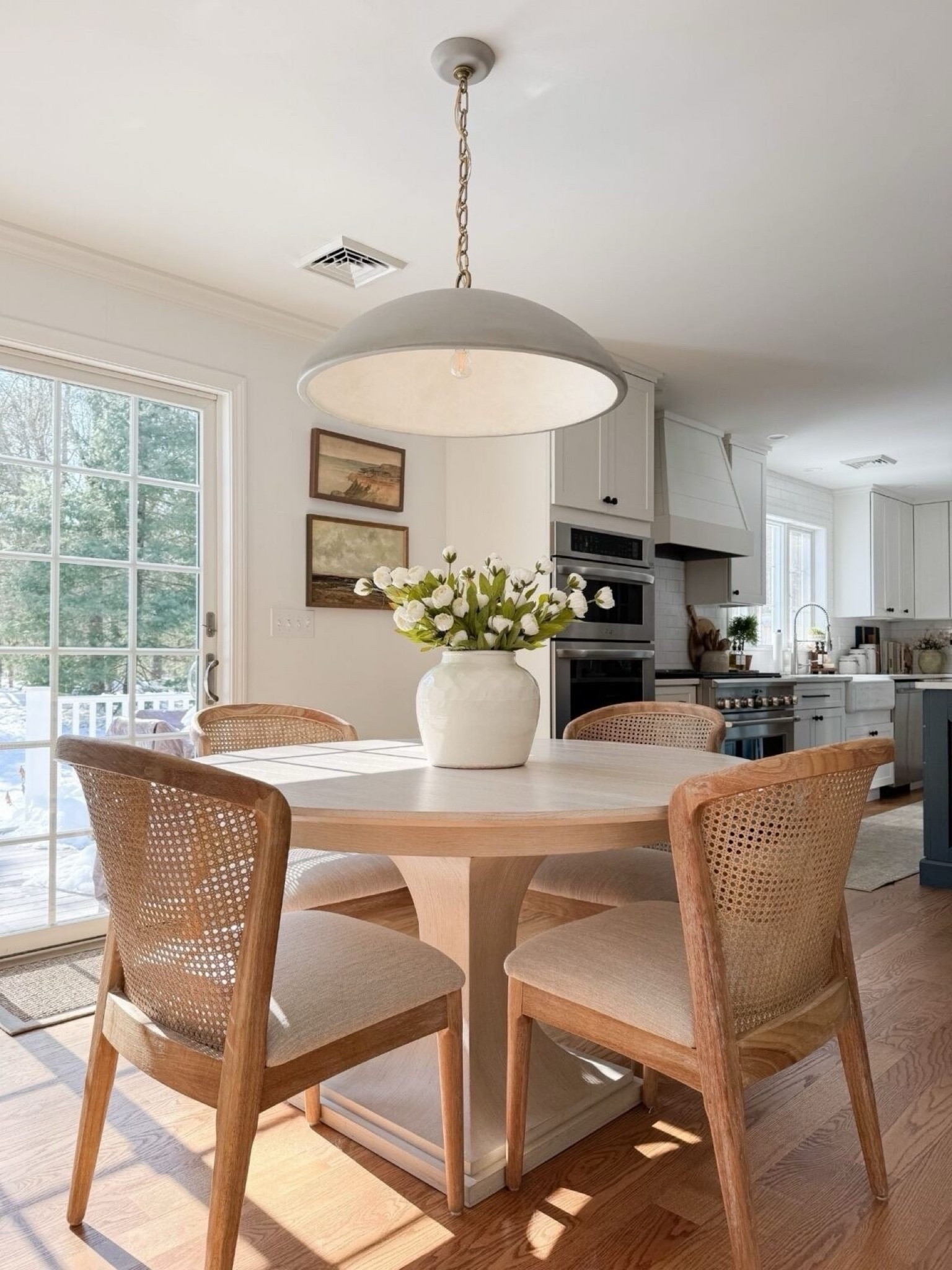 Coastal dining room styled with round wood table, woven dining chairs, faux peony centerpiece, and soft natural light for relaxed coastal dining.

coastal dining room decor, round wood dining table, woven dining chairs, faux peony centerpiece, neutral dining room styling, coastal interior decor, light coastal home, neutral dining room inspiration, sherricalnanhome

#LTKHome