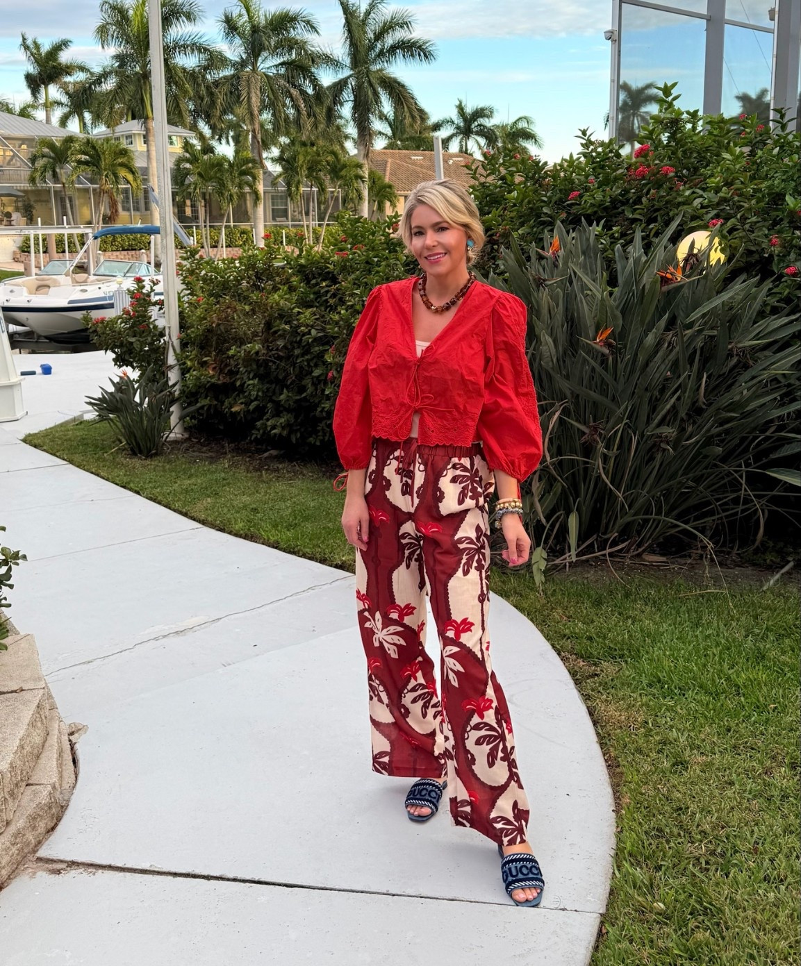 Avara palm print pants 🌴.

Amber Amazon  beaded necklace 🤎

Turquoise beaded heart earrings 🩵

Gucci slides 💙

#LTKGiftGuide #LTKdayinmylife #LTKootd