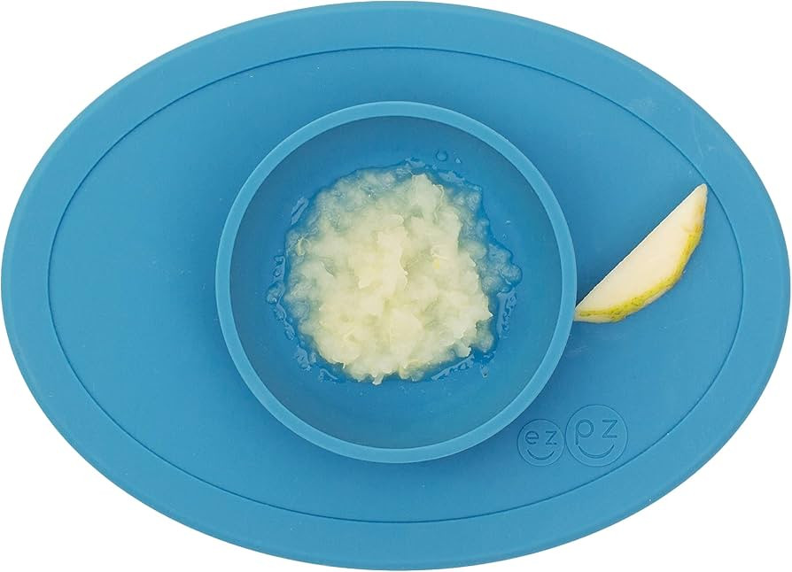 ezpz Tiny Bowl (Blue) - Silicone Baby Bowl with Suction for 6 Months + - Built-in Placemat - Firs... | Amazon (US)