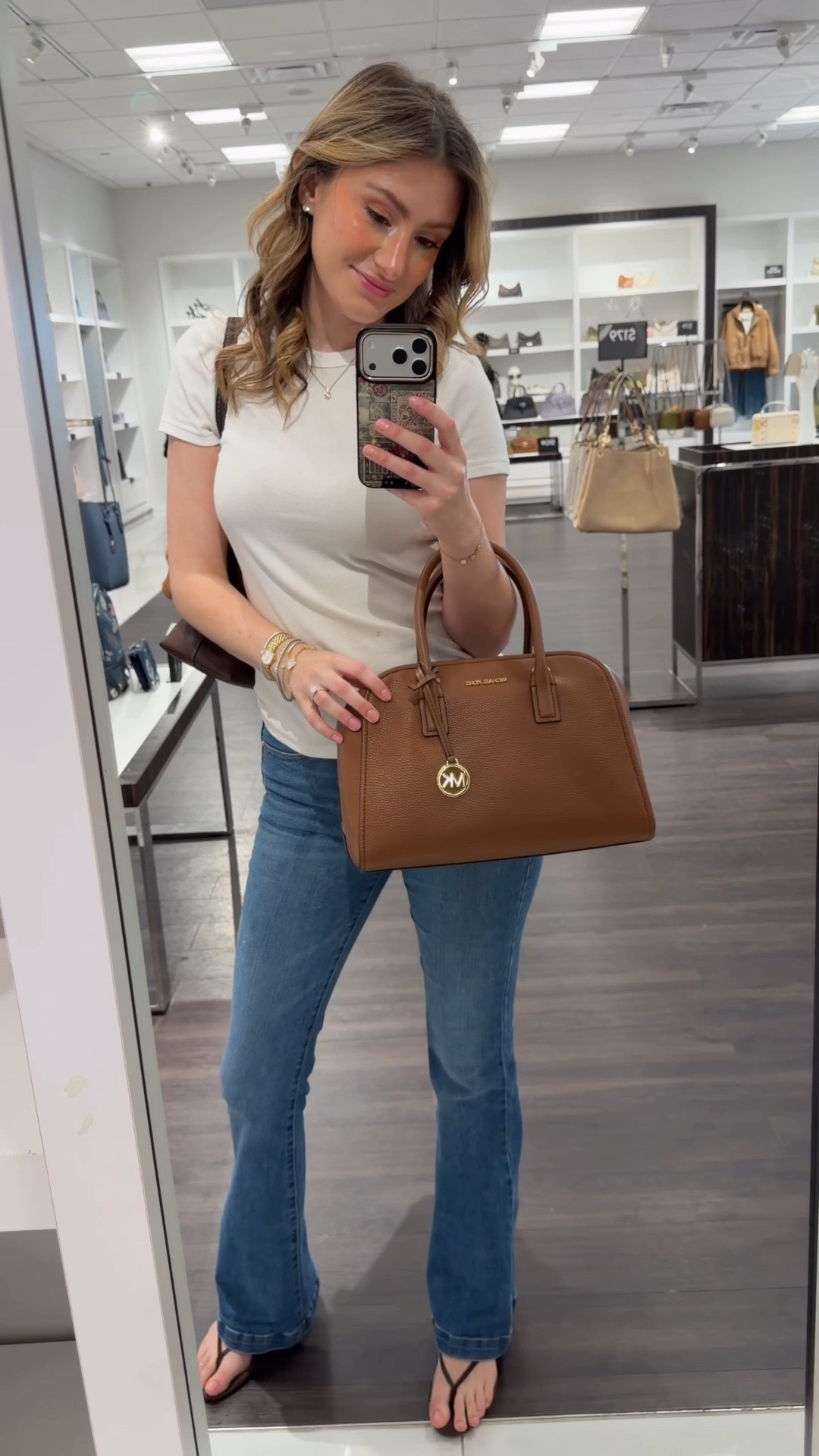 It’s been years since I’ve been in a Michael Kors Outlet but this bag drew me in 😍 Comment SHOP & I’ll dm you the links ♥️

I went in for the plaid bags but ended up seeing so many cute bags 😍
The nayla bag gives me major coach Brooklyn or Coach outlet Ella vibes which I love!
They also had such beautiful shades of green like the green suede Sammy convertible bag and the small Greta. 
I think Michael Kris has one of the prettiest brown/ tan shades of leather there is! 

Have you shopped at Michael Kors recently?!