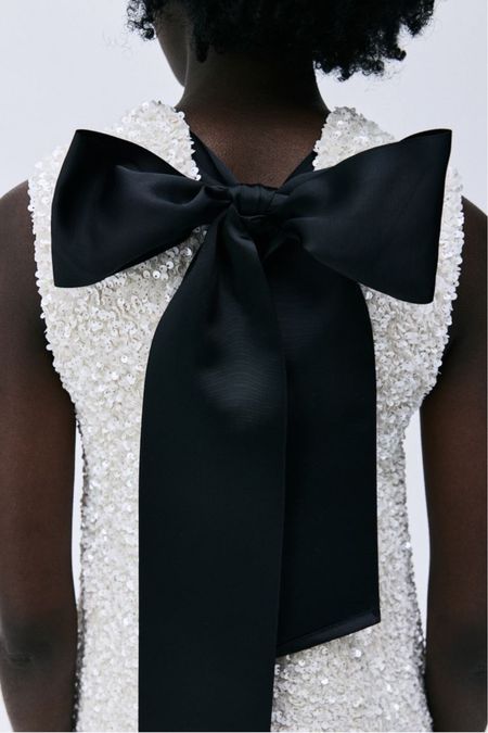 White sequined mini dress with bow back 

#LTKfindsunder100 #LTKstyletip #LTKSeasonal