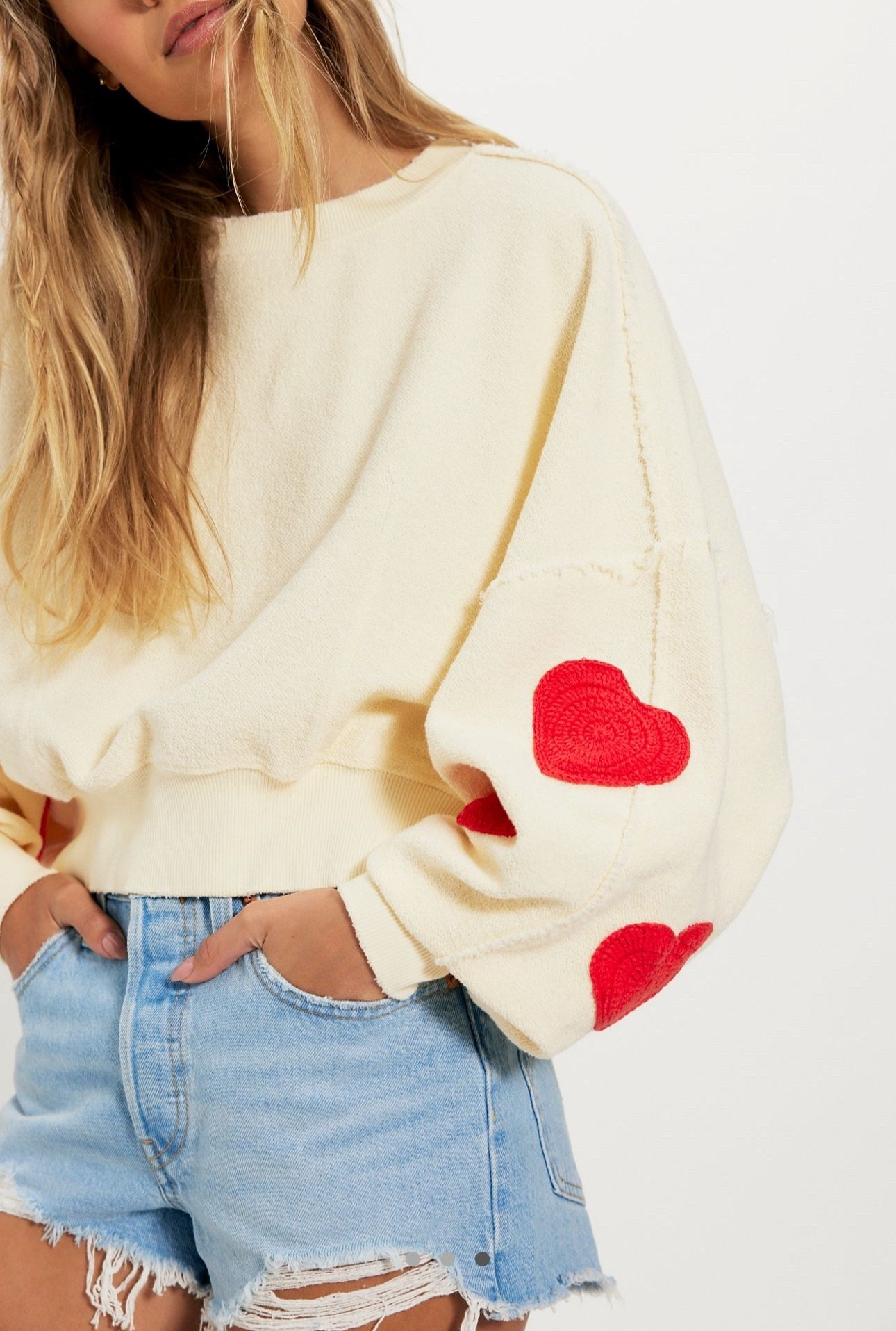 Free People: Wear your heart on your sleeve (literally) with this sweater from Tricia Fix, featuring a slouchy dolman-sleeve silhouette, a lightweight cotton fabric, and crocheted hearts for a touch of romance

#LTKootd #LTKSeasonal #LTKValentine