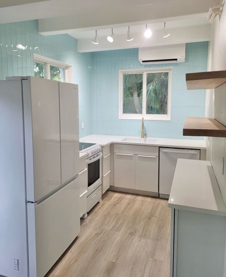 Kitchen remodel
White kitchen
Beach house kitchen
Floating shelves 
White modern fridge 
White modern appliances 
Small kitchen
Coastal kitchen 
Light blue tile 
Blue subway tile 
Aqua subway tile 
White and blue kitchen 
Kitchen design 


#LTKfindsunder100 #LTKhome