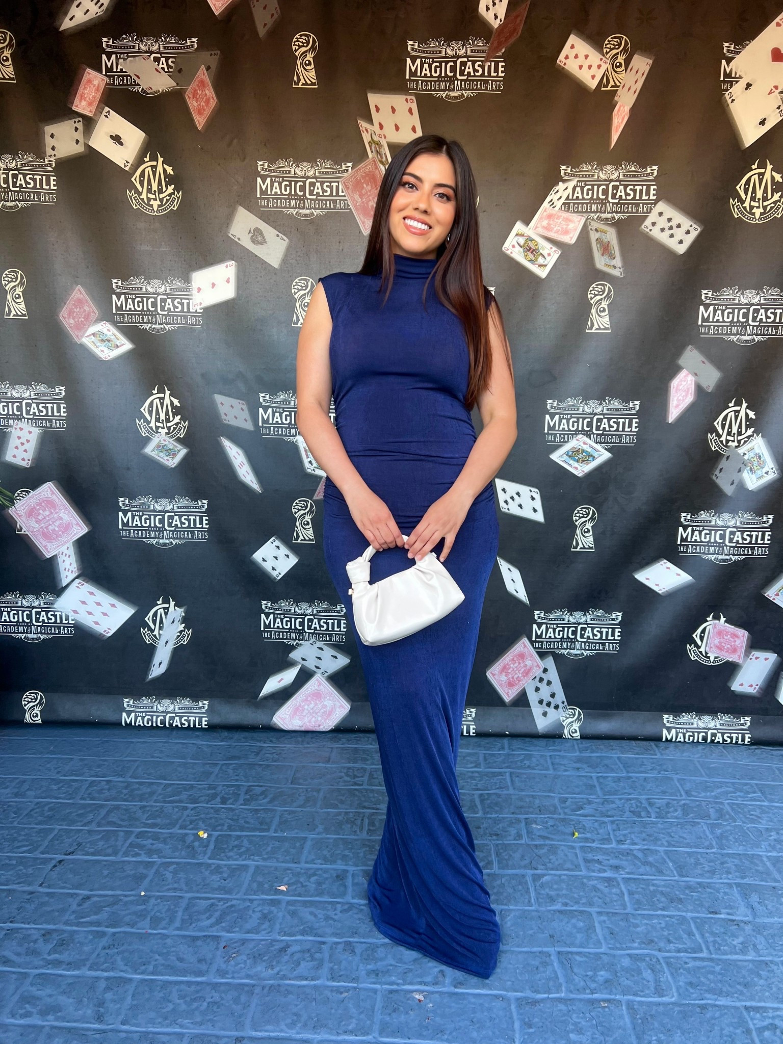 This elegant evening look features a form-fitting navy blue sleeveless maxi dress with a mock neck that creates a sleek and sophisticated silhouette. Styled with a minimalist white ruched handbag, the outfit strikes the perfect balance between classic and modern. Ideal for formal events or a night out, this polished look is a must-have in your LTK evening wear or event style collection.

#LTKSeasonal #LTKWedding