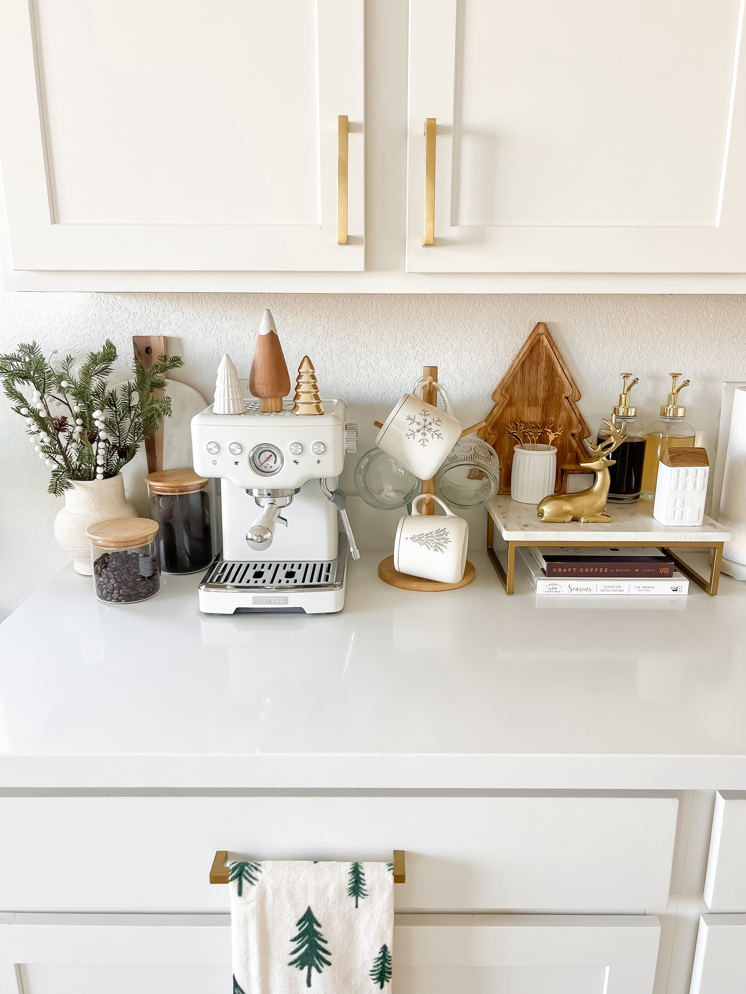 Neutral minimalist Christmas coffee bar decor | Christmas coffee bar decor ideas, Christmas coffee bar styling, coffee bar Christmas decor, how to style a coffee bar for Christmas, Christmas coffee bar ideas, Christmas coffee station decor, neutral Christmas decor, minimalist Christmas decor, gold reindeer coffee spoons, gold holiday coffee spoons, holiday mugs, Christmas mugs, wood tree serving tray, wood holiday serving tray, mini ceramic trees, mini gold trees, mini ceramic houses, gold glass syrup dispensers, white espresso machine, white espresso maker, holiday coffee syrups, holiday stems, Christmas stems, Amazon Christmas decor, Amazon home decor, Target home decor, Target Christmas decor, neutral kitchen decor, neutral home decor

#liketkit #LTKHome #LTKSeasonal #LTKFindsUnder100 #LTKGiftGuide #LTKHoliday #LTKStyleTip #LTKSaleAlert #LTKFindsUnder50 #LTKSeasonal 