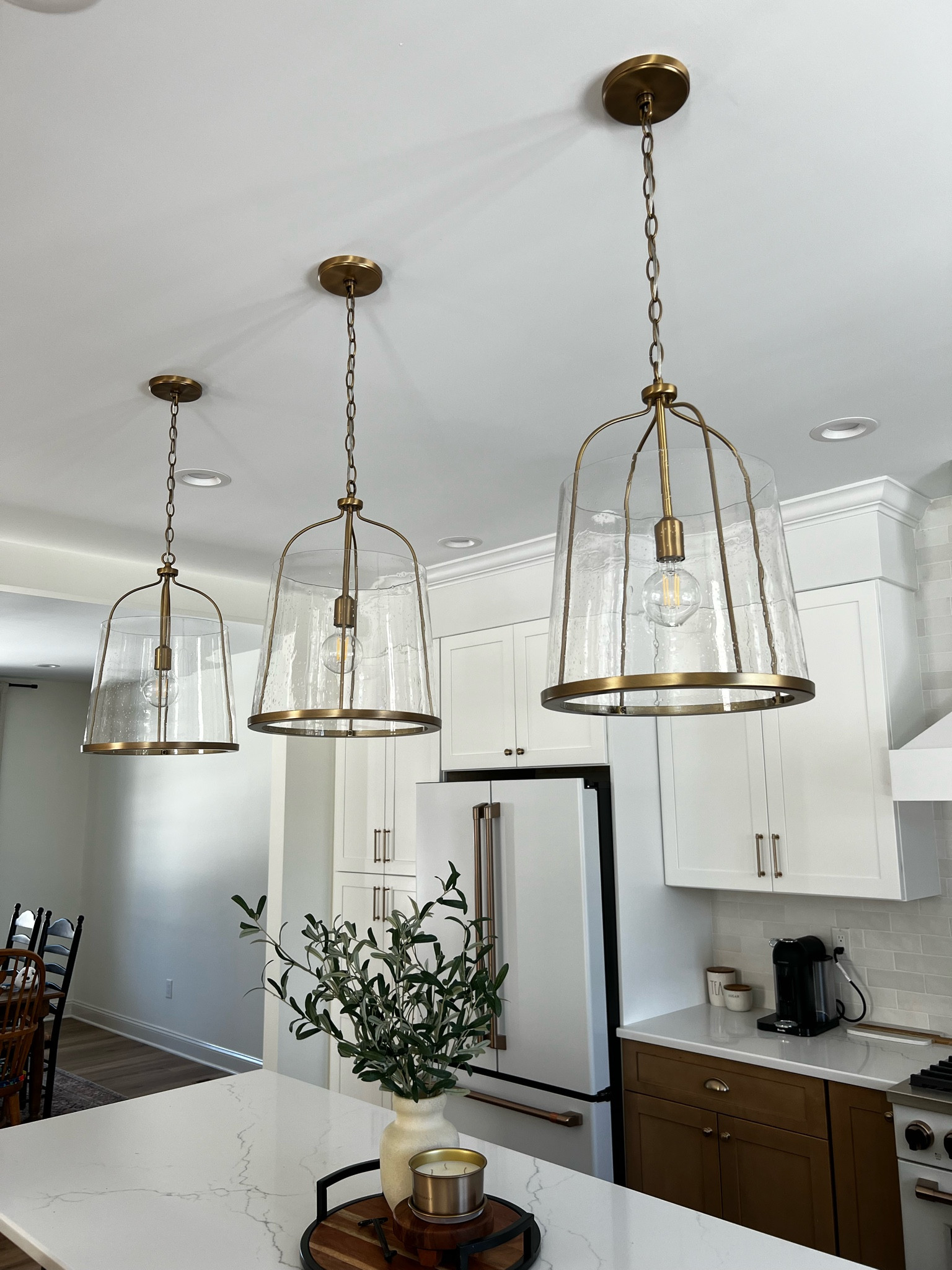 Close up of our kitchen pendant lights. Kitchen pendant lighting, kitchen island pendant, pendant light kitchen, kitchen light fixture, kitchen lighting, brass pendant light, brass chandelierr

#LTKhome #LTKstyletip