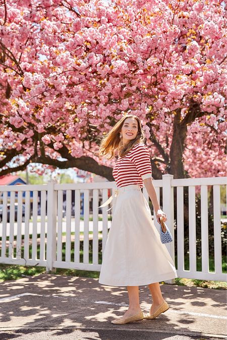 Nautical spring style. This gorgeous white skirt has a nice heavy fabric (lining is top notch) and my favorite vintage vibes while this lightweight striped sweater is perfect for the cool spring mornings and warm afternoons. The woven ballet flats have cute white polka dots on them and go with literally any outfit 🌸 All fit true to size 

#LTKSeasonal #LTKfindsunder100 #LTKworkwear