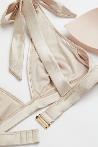 Conscious choice  New ArrivalLined, soft-cup bikini top. Wide, tie-top shoulder straps, cups with... | H&M (US + CA)