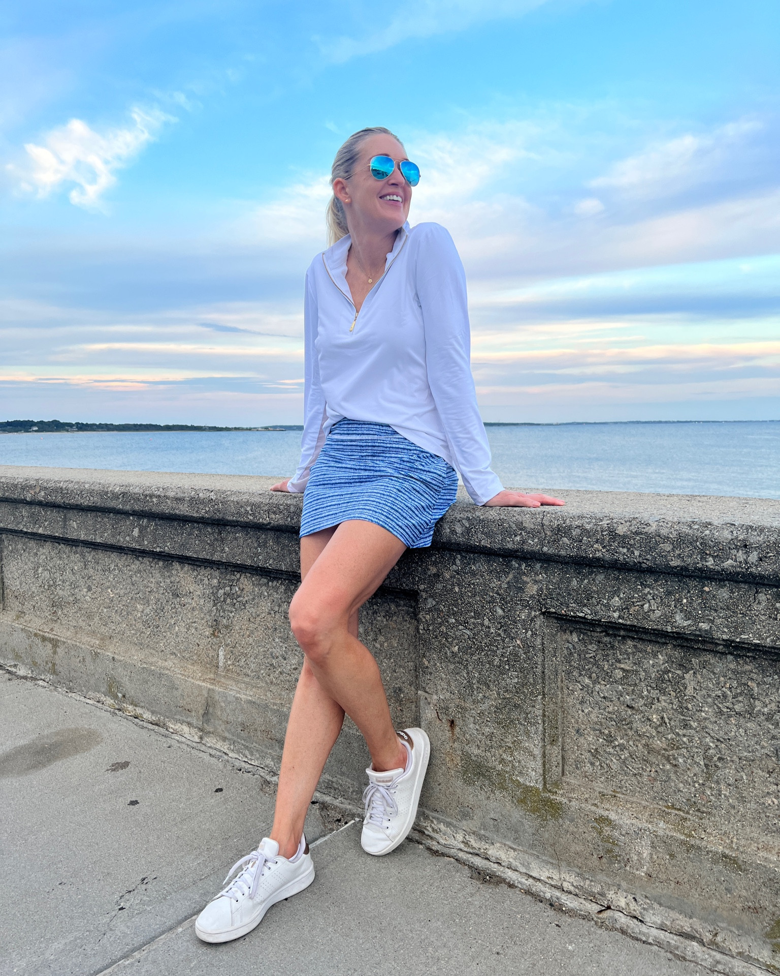 Sporty fall transition look. White quarter zip, printed skort with UPF protection.



#LTKunder100 #LTKsalealert #LTKSeasonal