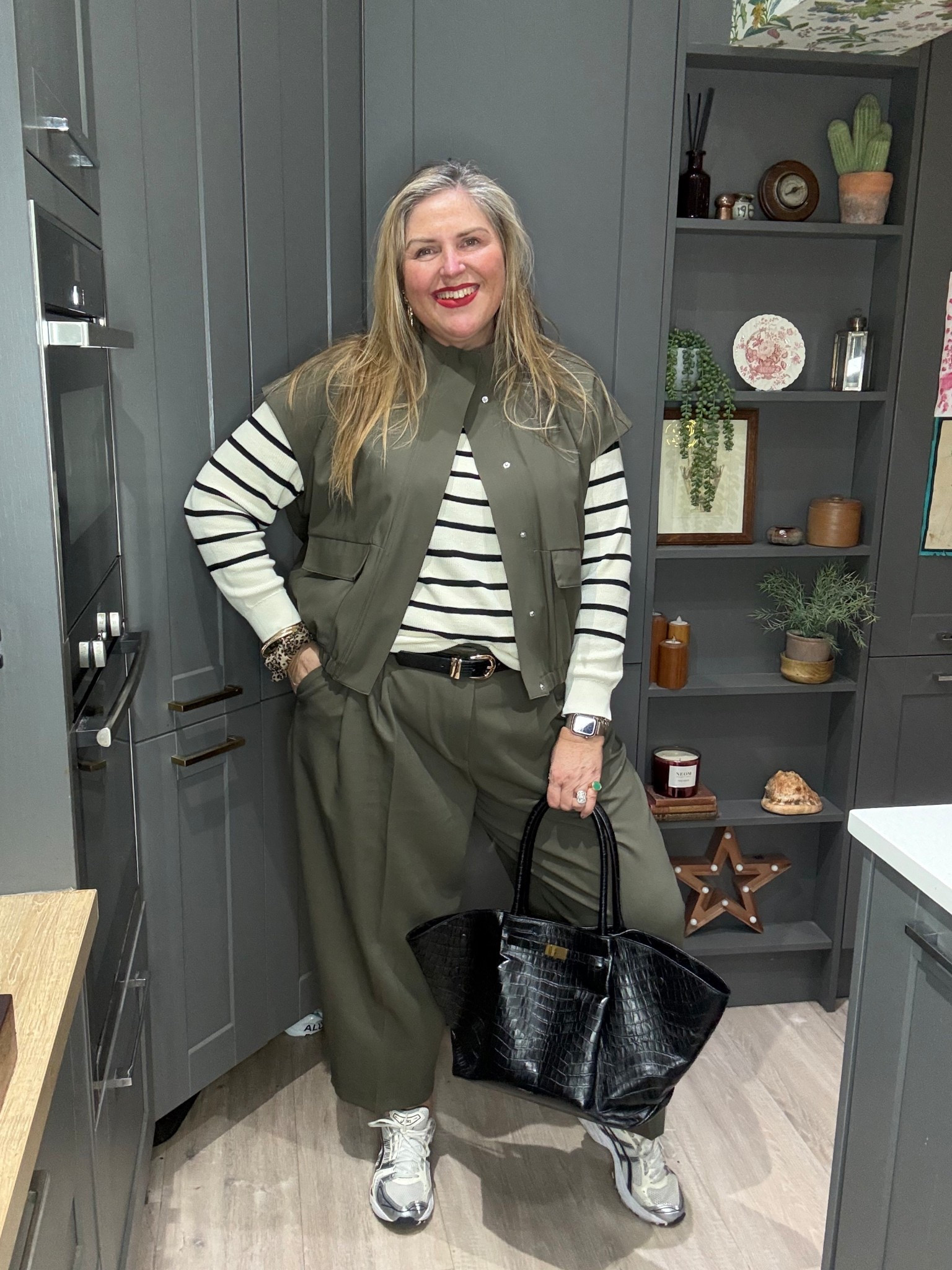 Khaki barrel trousers, khaki sleeveless jacket, striped jumper, black bag , trainers 

#LTKspring #LTKworkwear #LTKplussize