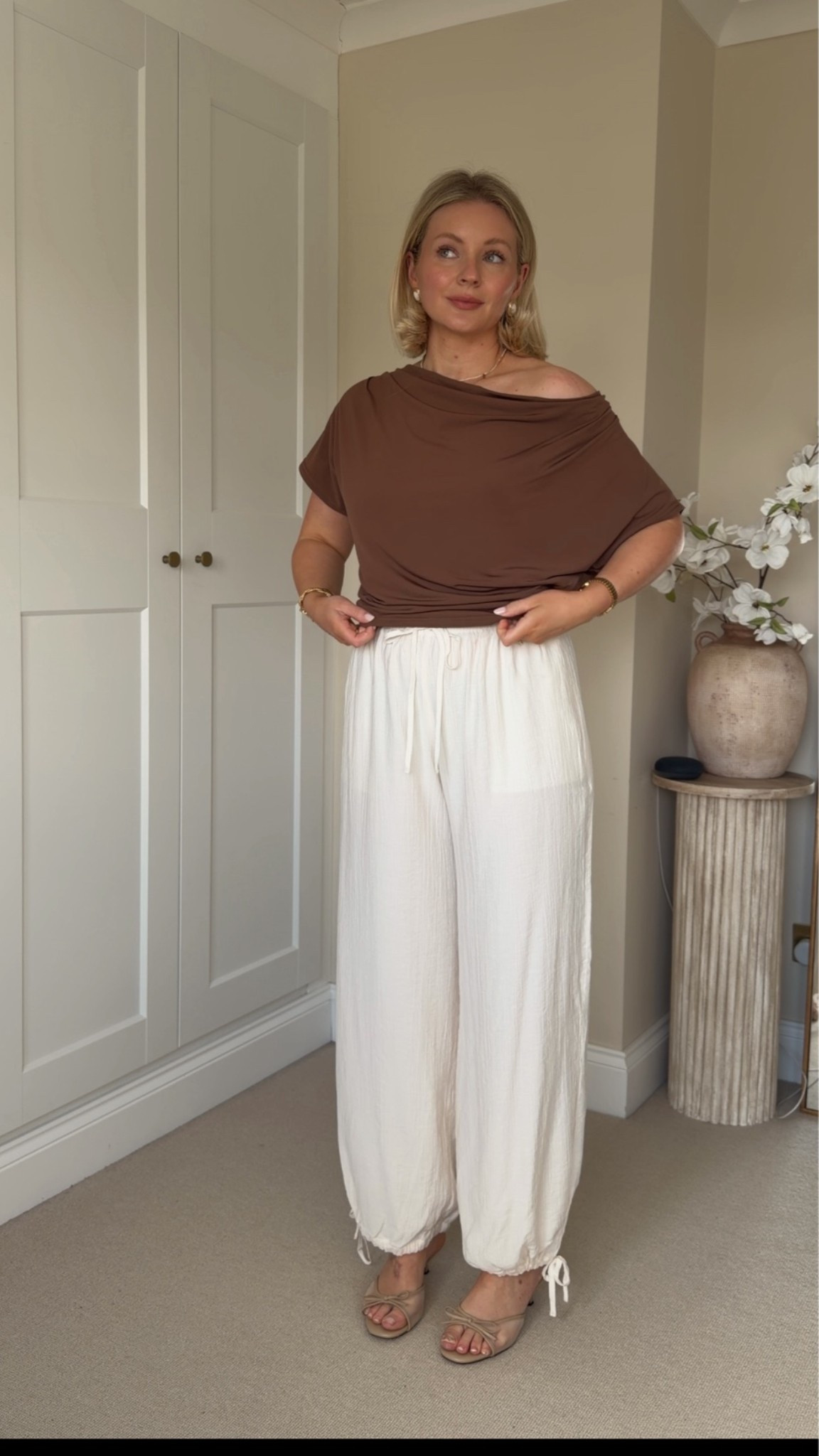 @abercrombie asymmetrical brown top size S paired with cream crinkle ballon trousers size S. 
DISCOUNT CODE: AFLAURA