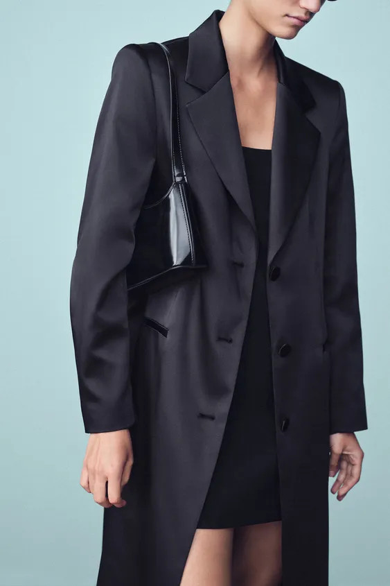 Coat with a lapel collar and long sleeves with shoulder pads. Features welt front pockets and a b... | Zara US