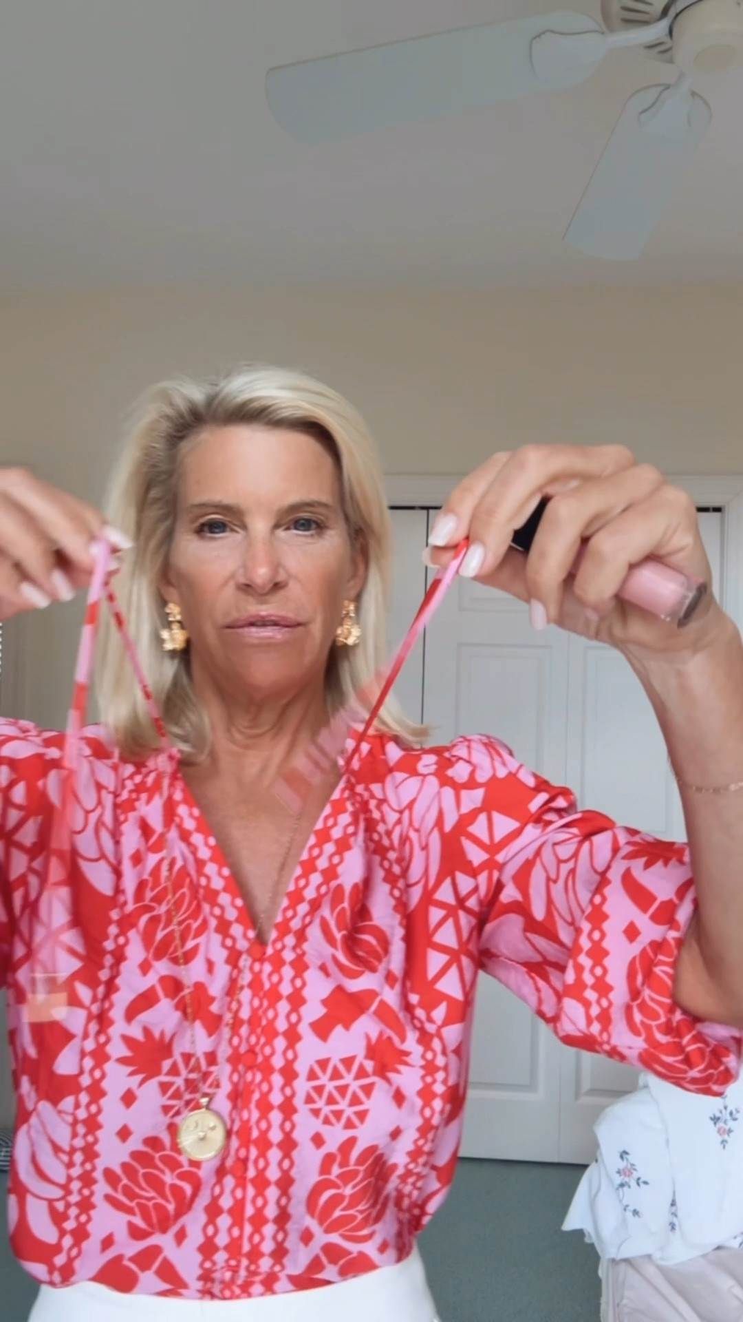 I do not like little ties on my blouses. I just don’t like them to hang and I don’t like them tied. So 9/10 times I chop them off 😂. I do love a pink and red floral combo.  These high waisted white shorts are amazing with beige rodent leather sandals 🩷

#LTKOver40 #LTKootd #LTKTravel