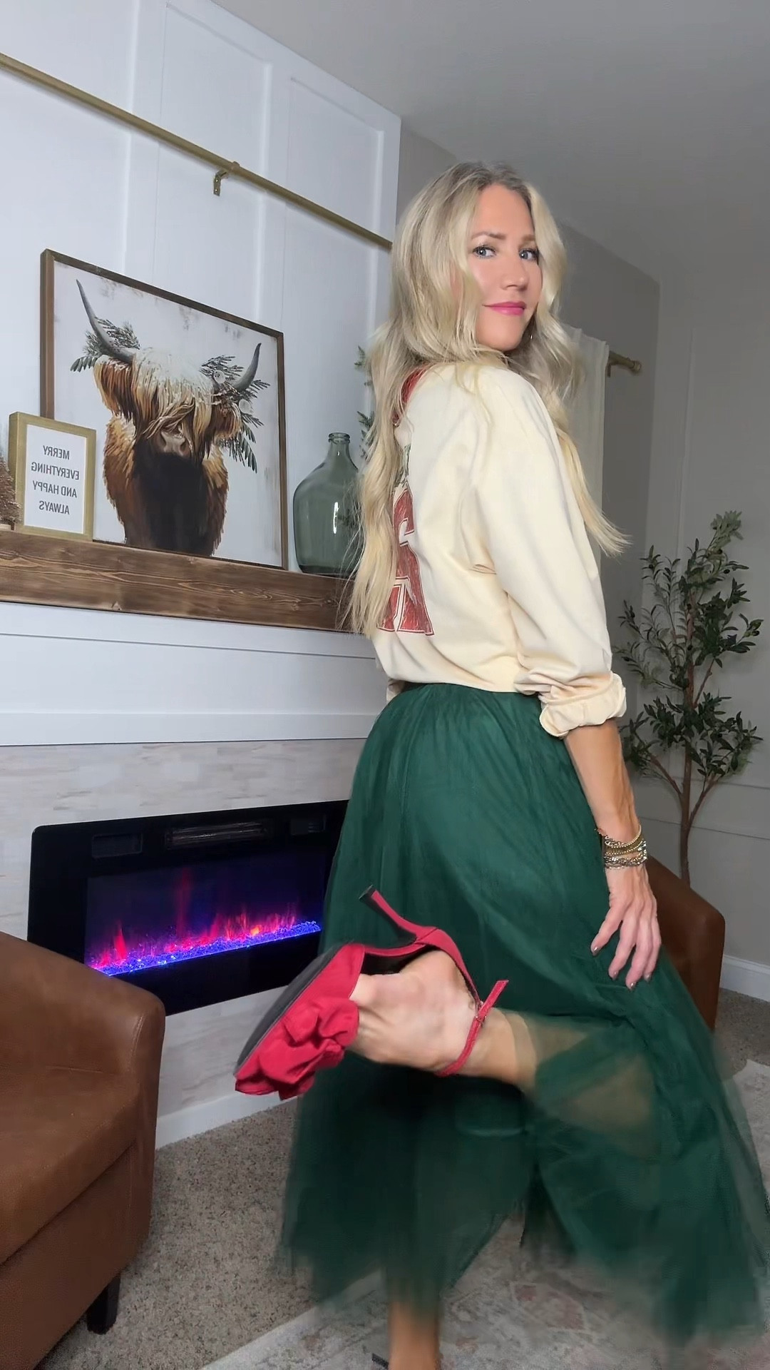 Holliday look with twirly floaty skirt and a sweatshirt with red heels. Perfect for Christmas parties Christmas gatherings Christmas dinners over 40 Fashion Mom Christmas looks and holiday styling.

#LTKootd #LTKHoliday #LTKOver40