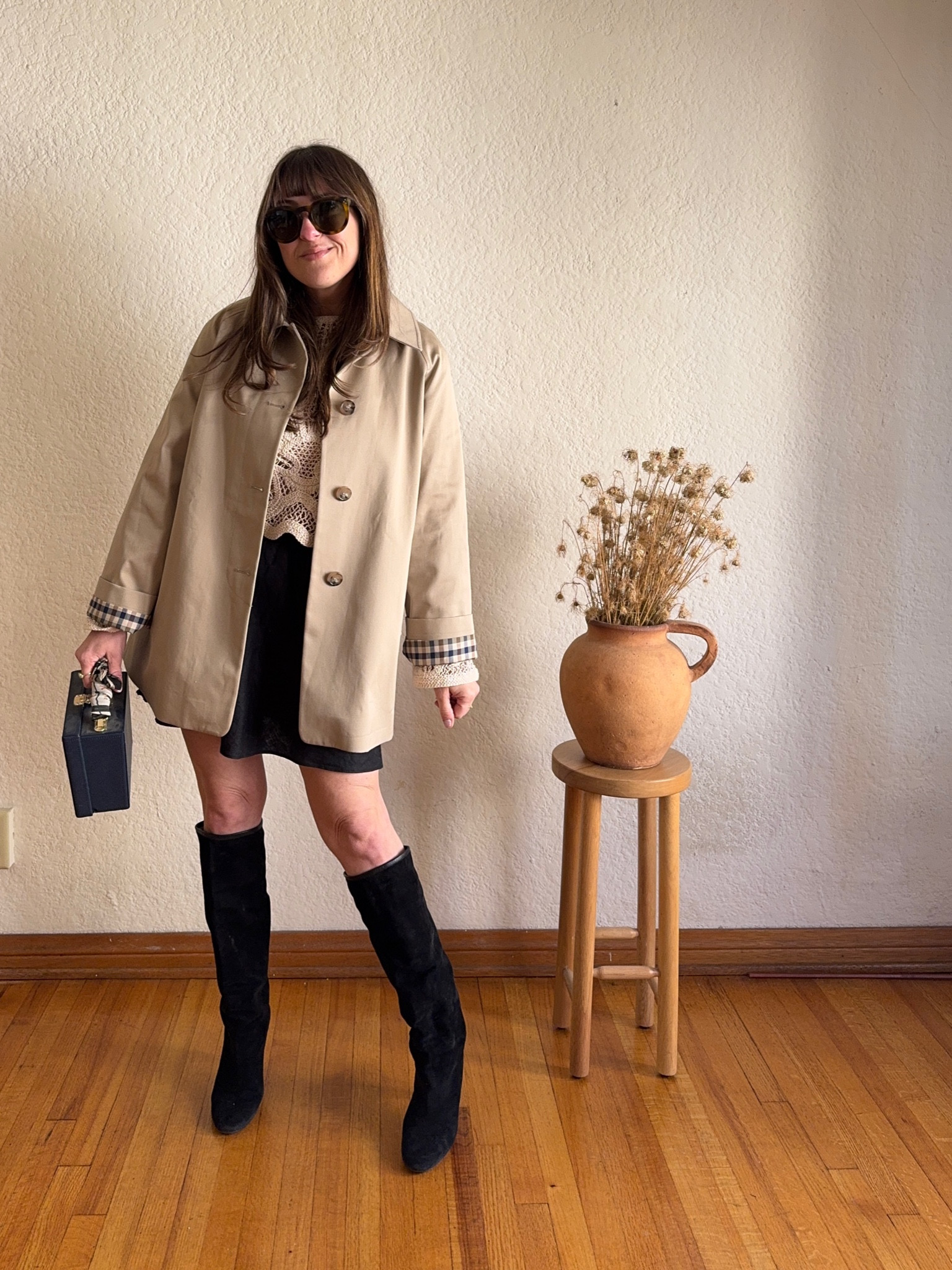 Sezane Carter Coat styling with black mini skirt and boots