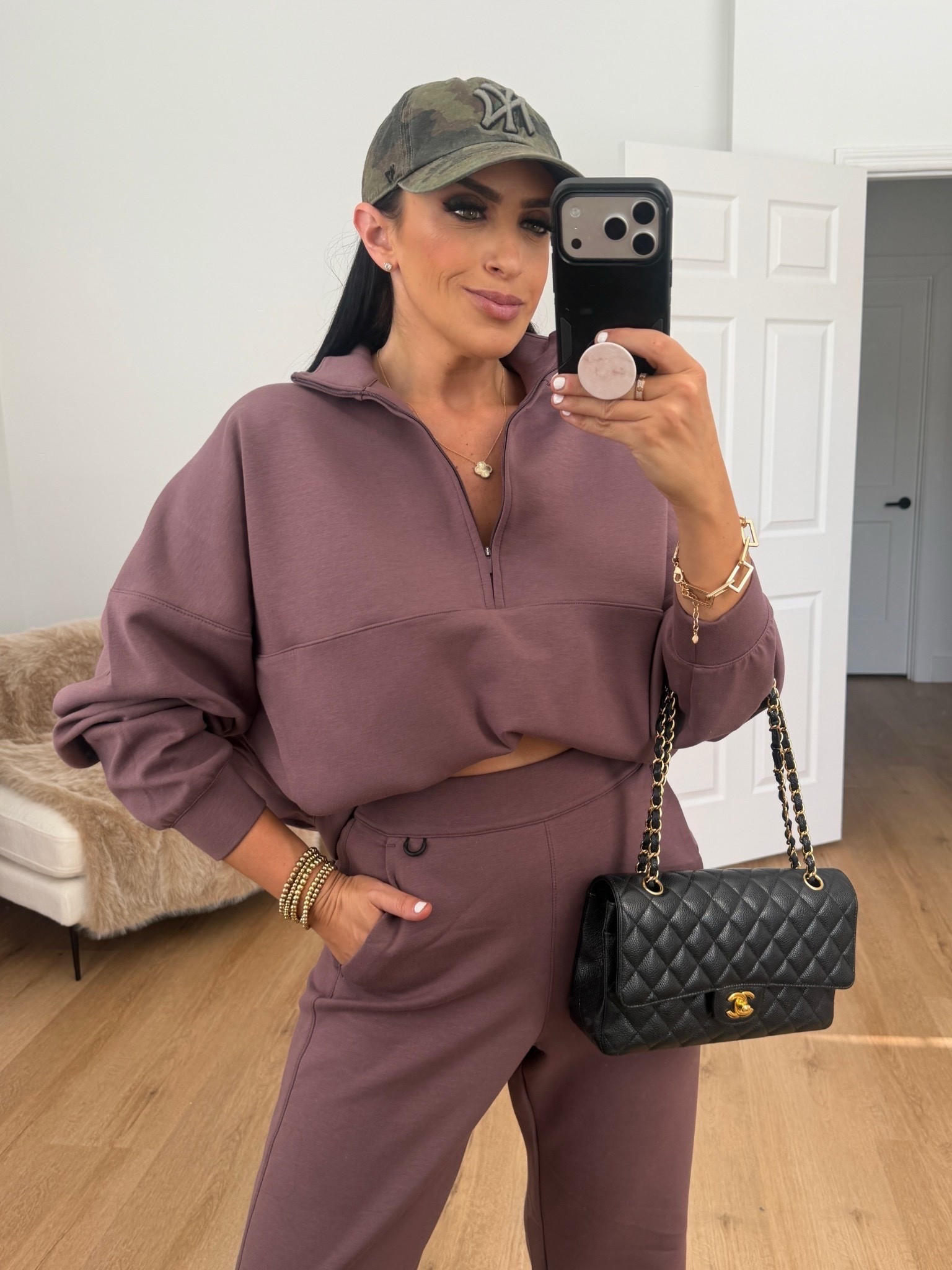 Woman’s Nike 24.7 ImpossiblySoft Dri-FIT Oversized 1/2-Zip top. I’m wearing a size medium. 

Woman’s Nike 24.7 ImpossiblySoft Dri-FIT High-Waisted Loose Flared Pants. I’m wearing a size small. 
