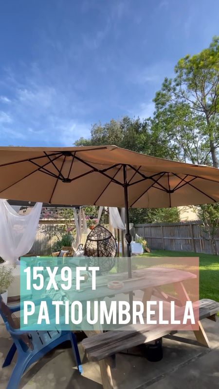 Shade in the backyard is a luxury in Texas. If there’s anything that’s quick and easy to put up and get your yard summer ready, this is it!  This extra large, 15 x 9’ patio umbrella does the trick.  It’s HUGE, like a triple sized market patio umbrella providing ample shade, even greater shade cover than the backyard pergola we previously built and 1000x faster and easier to put together. 

Simply anchor the base in a patio table- we used a hole cutter to put this through the middle of our picnic table. When not in use, simply wind it down and put a cover over it (optional). 

#LTKSeasonal #LTKVideo #LTKhome