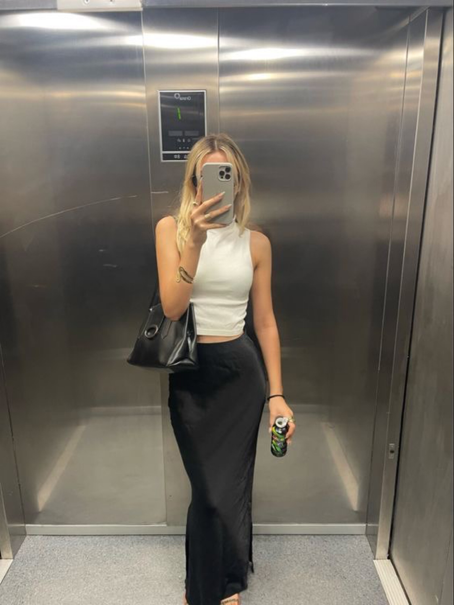 Silk maxi skirt outfit inspo - long black skirt with white tank top 

#LTKSpringSale #LTKSeasonal #LTKfindsunder50