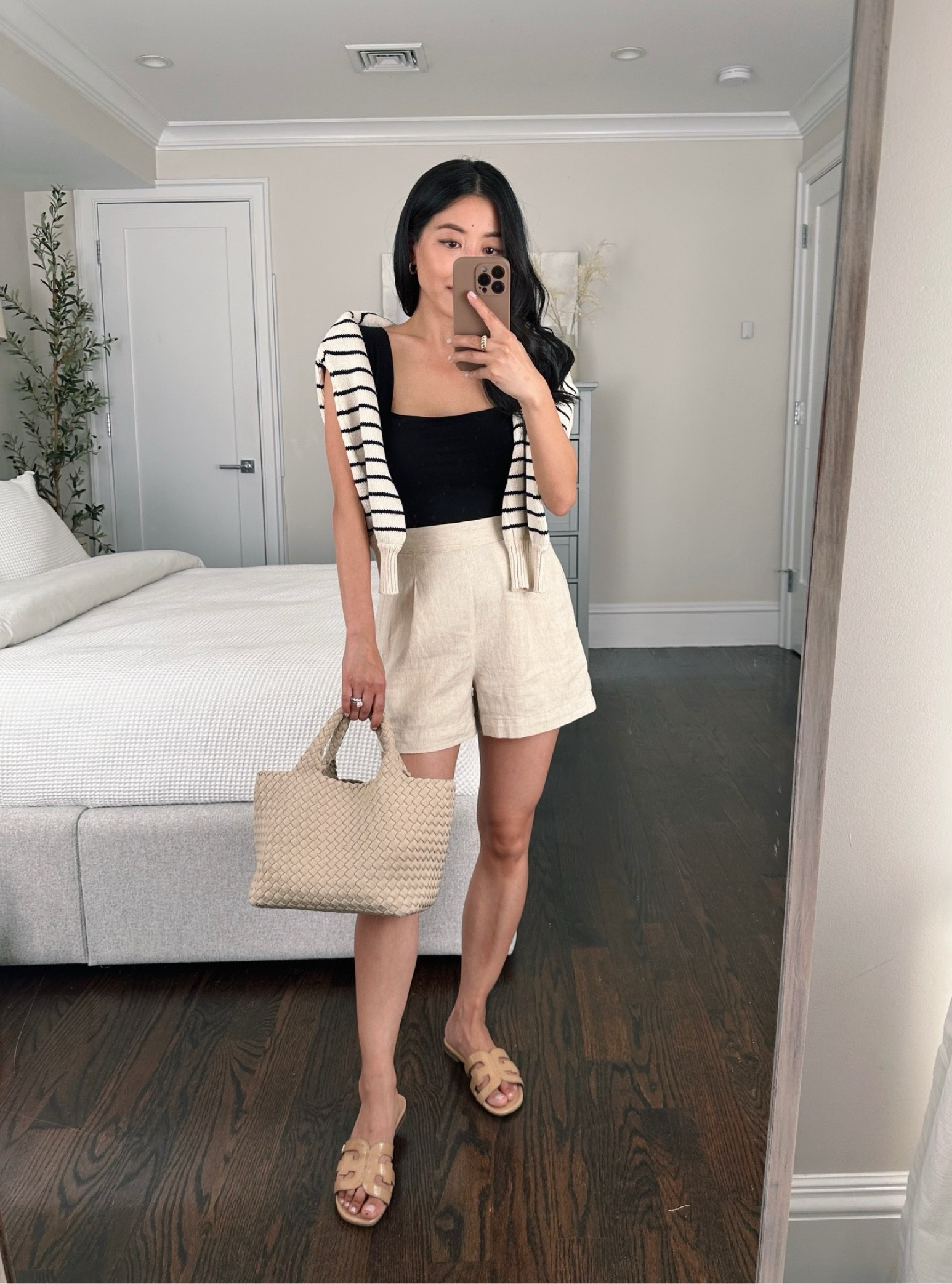 Easy but polished casual summer outfit with flats 

•Madewell shorts xxs - my favorite shorts! I also have them in black  

•Reformation tank xs (worn with nippies). I’ve had this one for years and it’s the perfect soft and lightweight little back square neck tank. Affordable price point for reformation and free ship. 

•Sezane striped sweater xxs

•Sam Edelman flat slide sandals sz 5. Can’t say enough good things about these comfy and practical shoes! Also good for pool or beach since the patent leather can withstand a little bit of wetness 

•Naghedi mini tote 

#petite

#LTKSeasonal #LTKsalealert #LTKstyletip