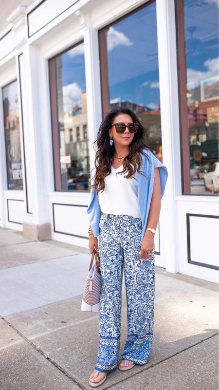 Summer Outfit
Affordable 
Blue & white paisley pants 
White v neck sleeveless top
Blue lightweight sweater
TTS CoalfieldFancy is wearing a size small in the top & sweater & extra small in the pants. 

#LTKover40 #LTKtravel #LTKfindsunder50